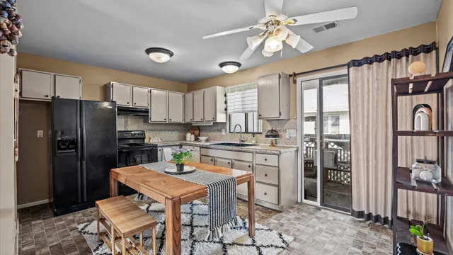 a kitchen with refrigerator cabinets and furniture