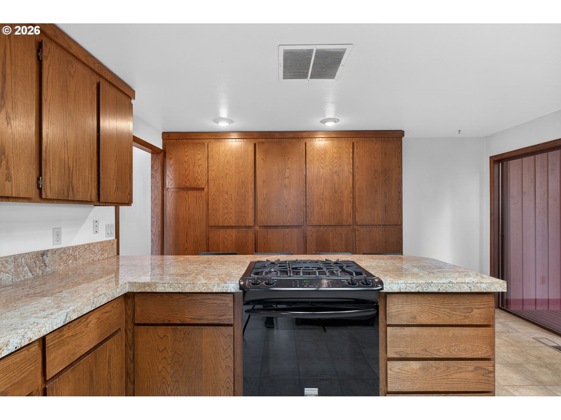 5205 Southwest 153rd Avenue Beaverton, OR 97007 - Photo 11 of 47 a kitchen with granite countertop cabinets stainless steel appliances and a counter space