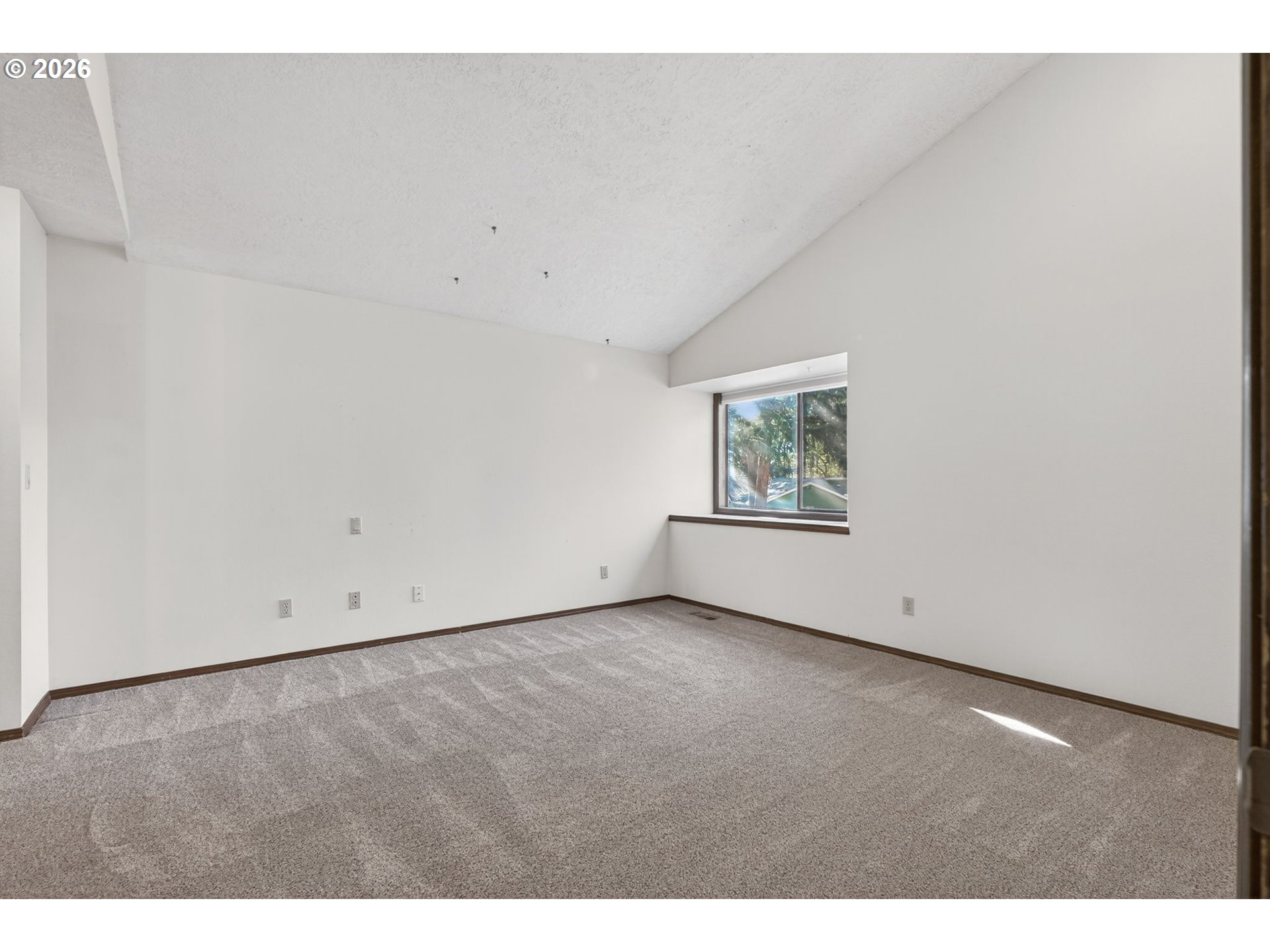 5205 Southwest 153rd Avenue Beaverton, OR 97007 - Photo 14 of 47 a view of an empty room with a window