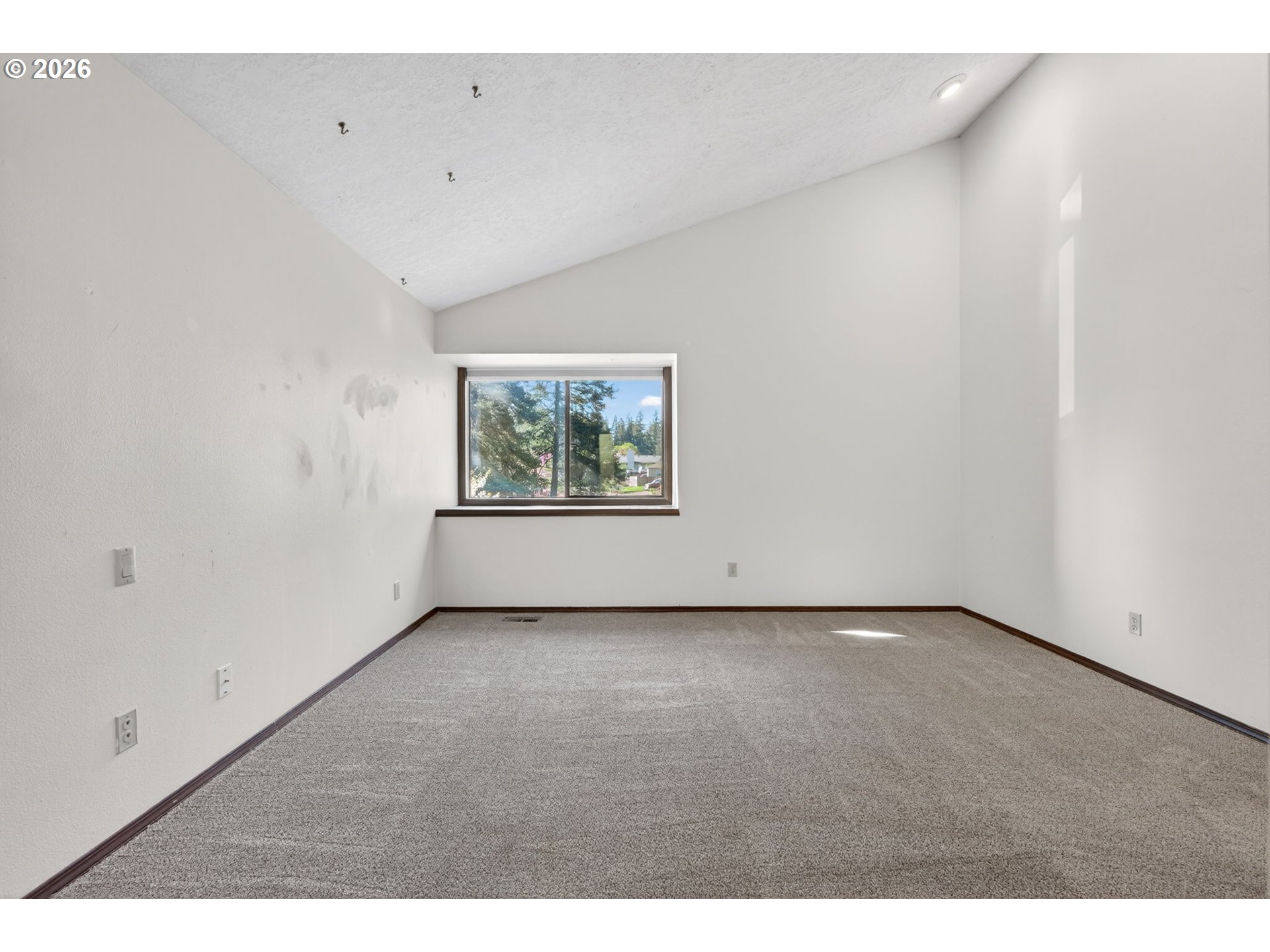5205 Southwest 153rd Avenue Beaverton, OR 97007 - Photo 16 of 47 a view of an empty room with a window