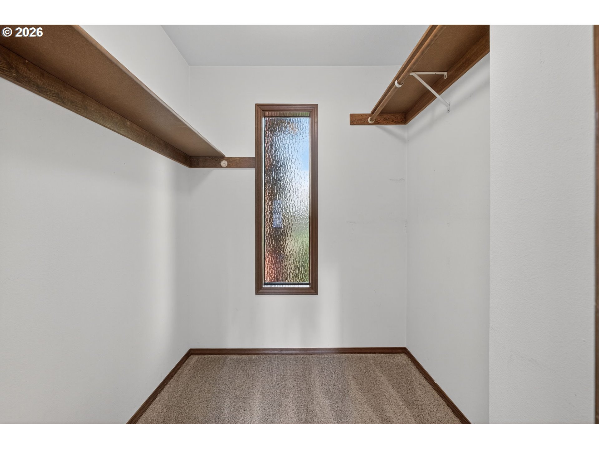 5205 Southwest 153rd Avenue Beaverton, OR 97007 - Photo 17 of 47 a view of an empty room with wooden floor and a window