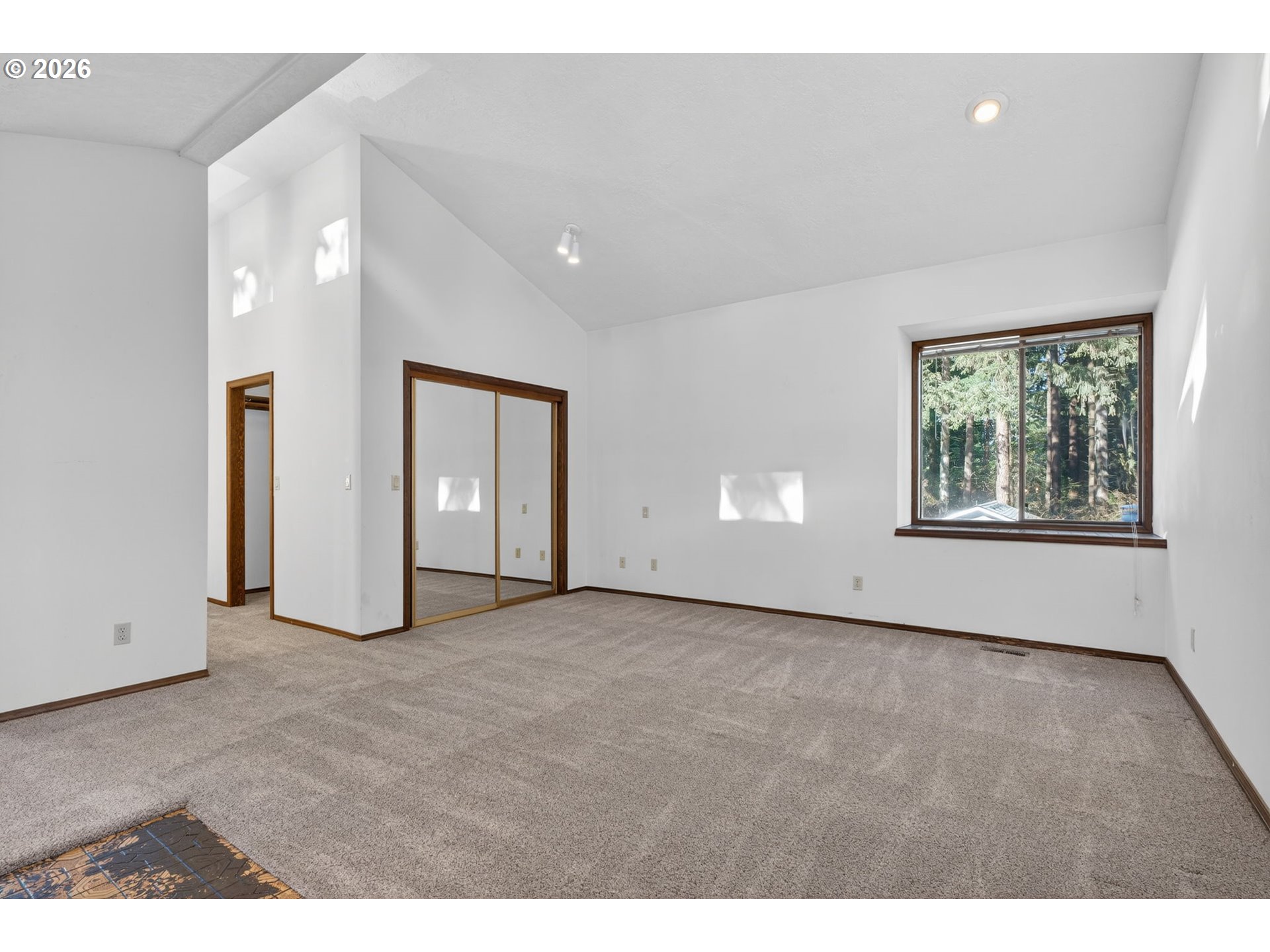 5205 Southwest 153rd Avenue Beaverton, OR 97007 - Photo 19 of 47 a view of an empty room with a window