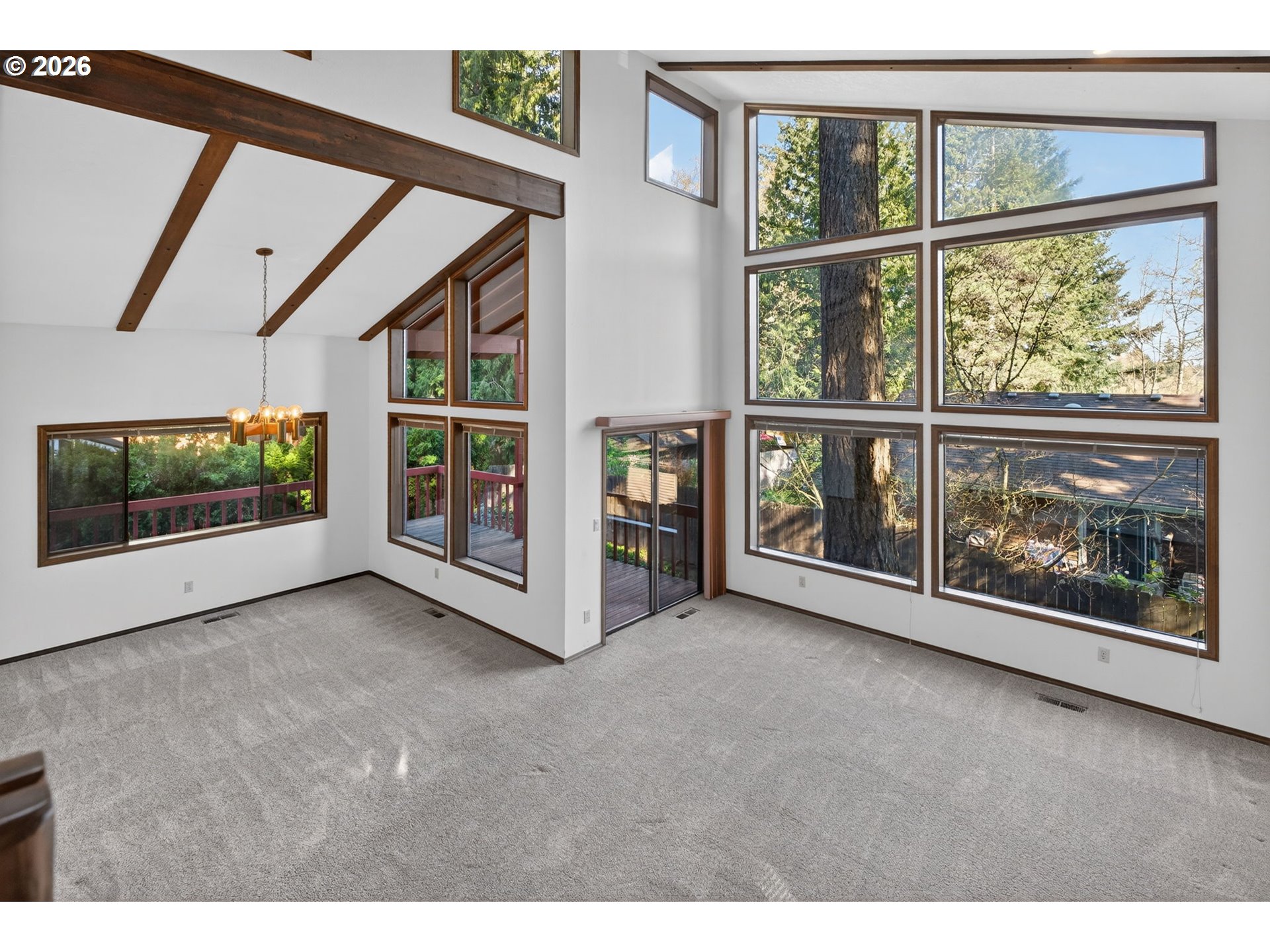 5205 Southwest 153rd Avenue Beaverton, OR 97007 - Photo 2 of 47 a view of an empty room with window and fire pit