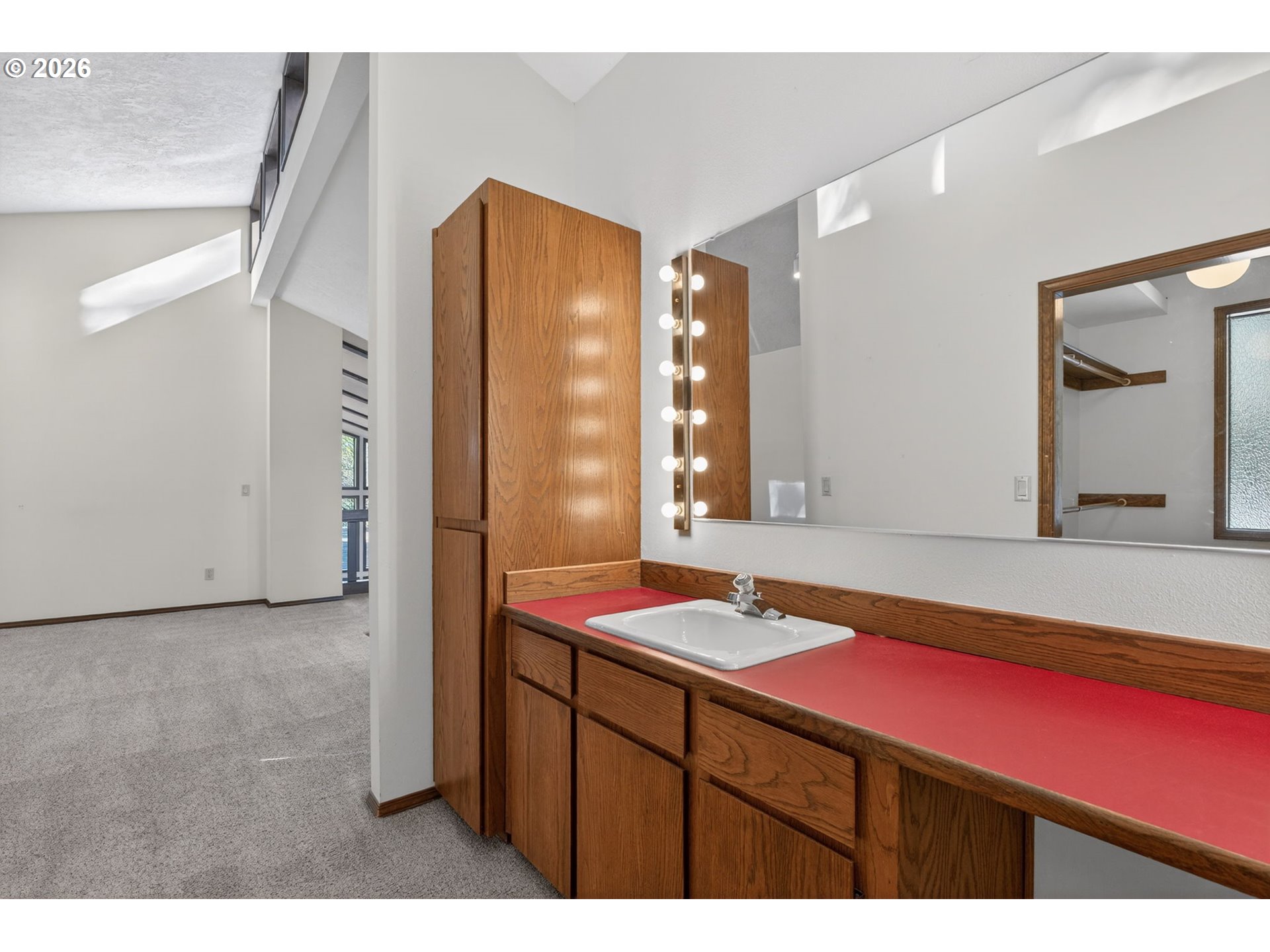 5205 Southwest 153rd Avenue Beaverton, OR 97007 - Photo 23 of 47 a bathroom with a sink a mirror and a bathtub