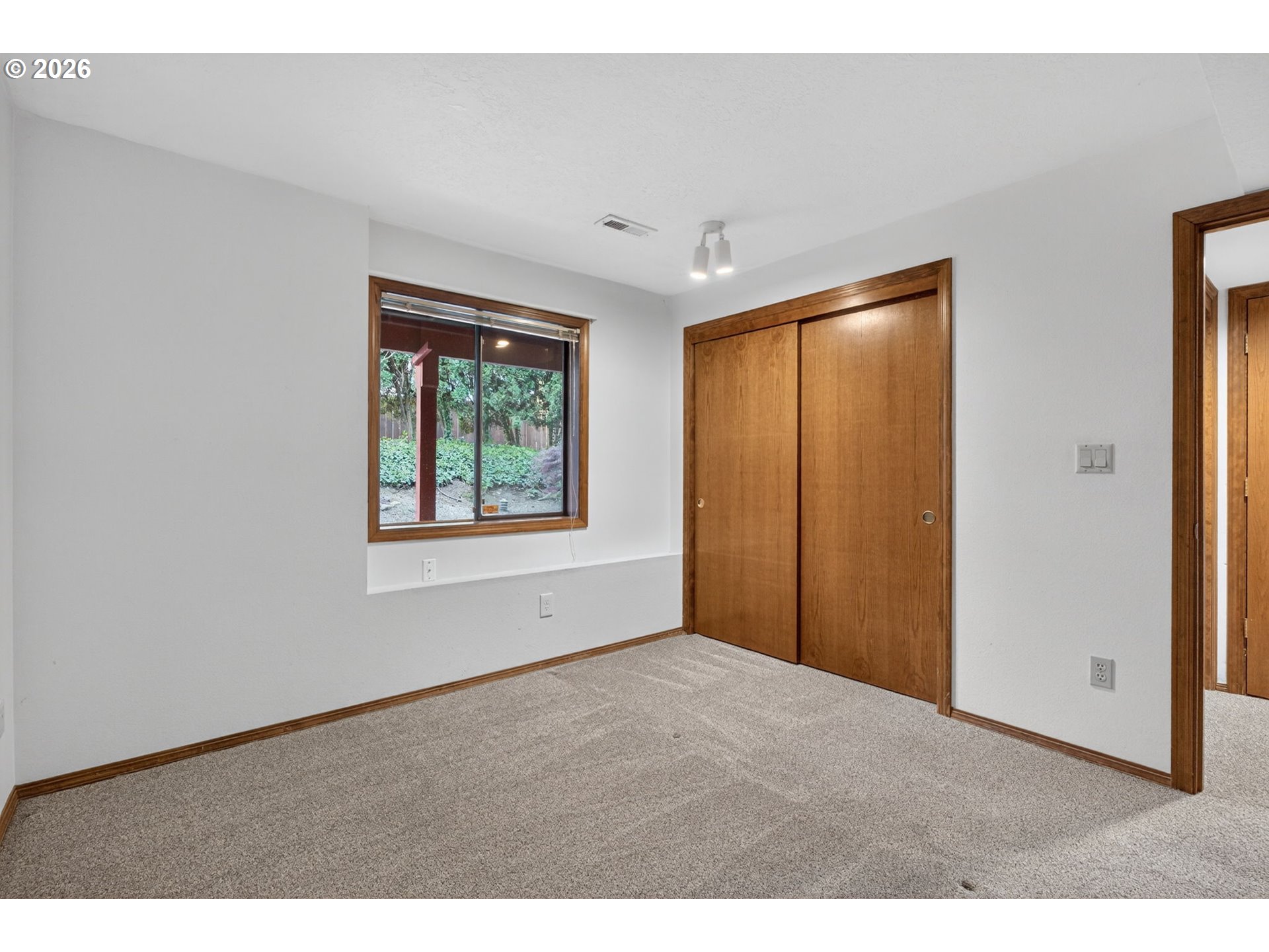 5205 Southwest 153rd Avenue Beaverton, OR 97007 - Photo 28 of 47 a view of an empty room with window and closet area