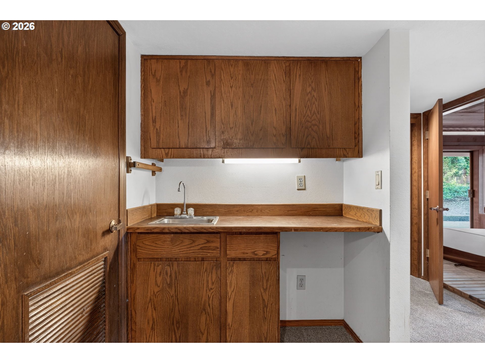 5205 Southwest 153rd Avenue Beaverton, OR 97007 - Photo 29 of 47 a kitchen with a sink a refrigerator and window