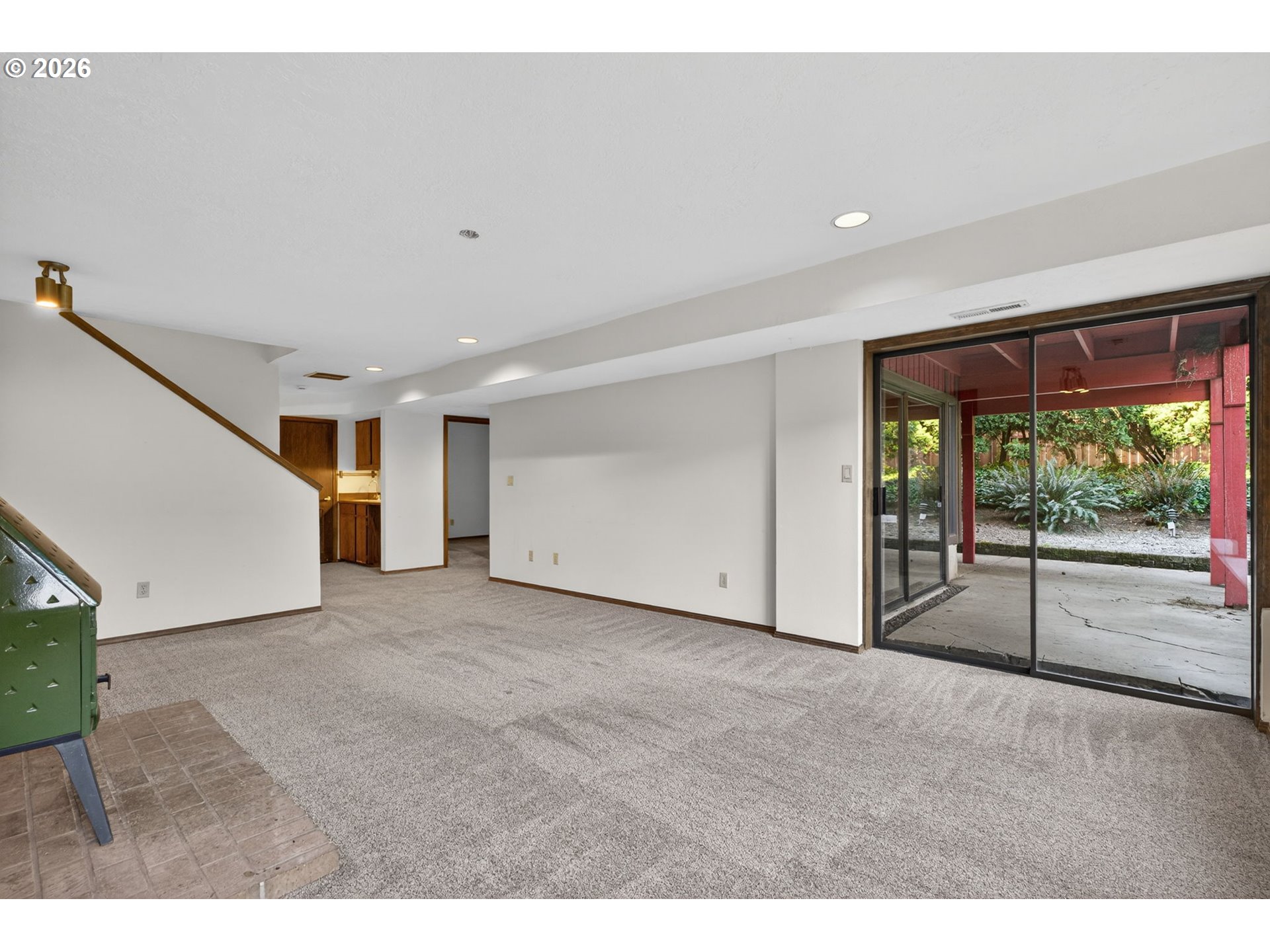 5205 Southwest 153rd Avenue Beaverton, OR 97007 - Photo 30 of 47 a view of an empty room with a sliding door