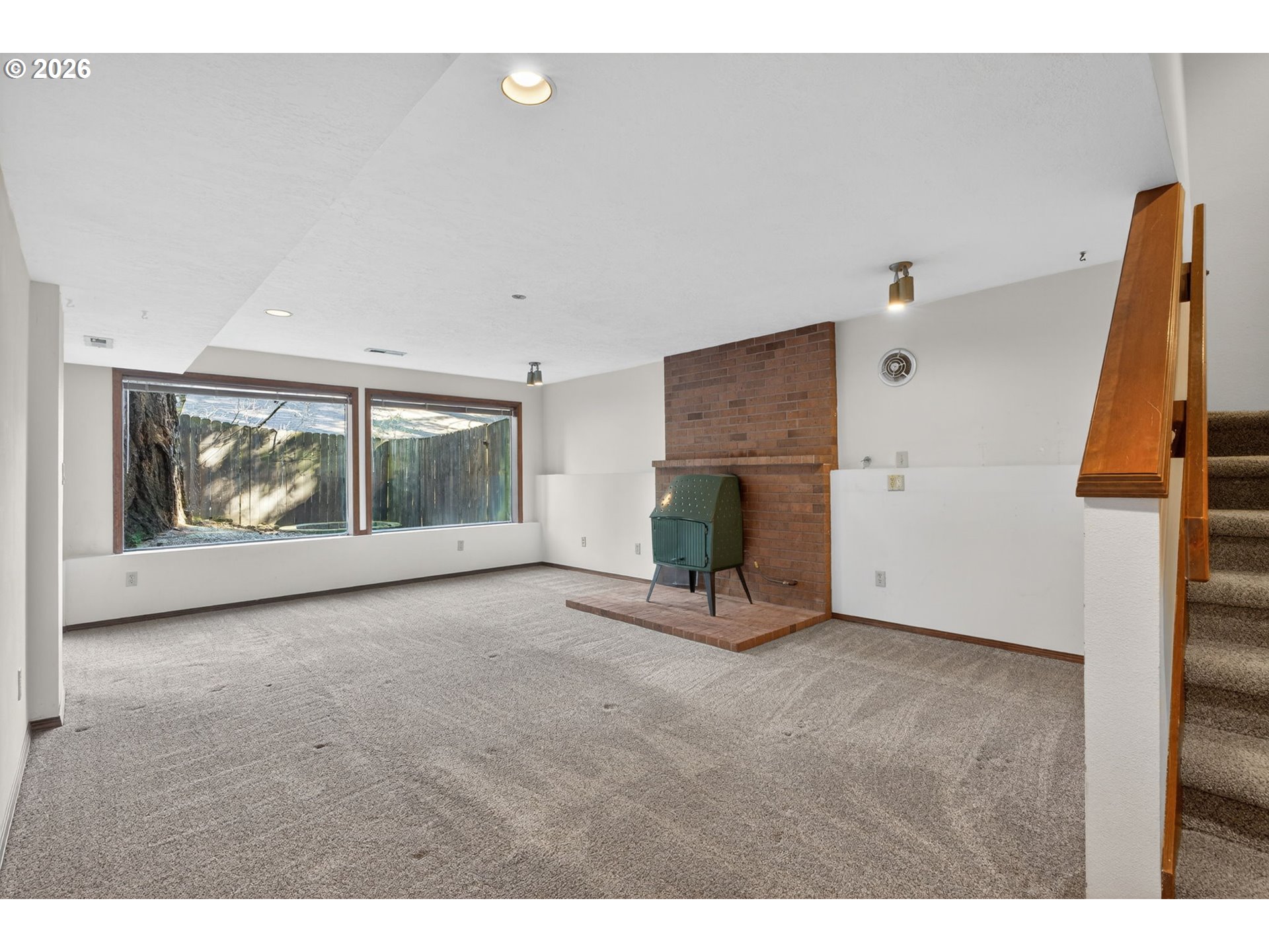 5205 Southwest 153rd Avenue Beaverton, OR 97007 - Photo 31 of 47 a view of an empty room with a fireplace