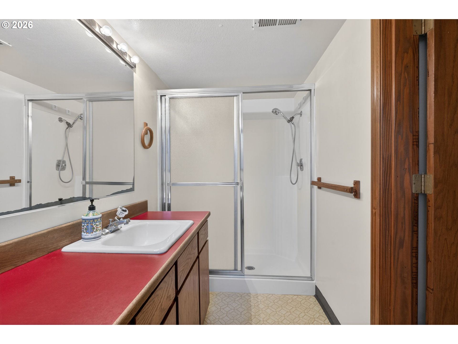 5205 Southwest 153rd Avenue Beaverton, OR 97007 - Photo 33 of 47 a bathroom with a sink and a mirror
