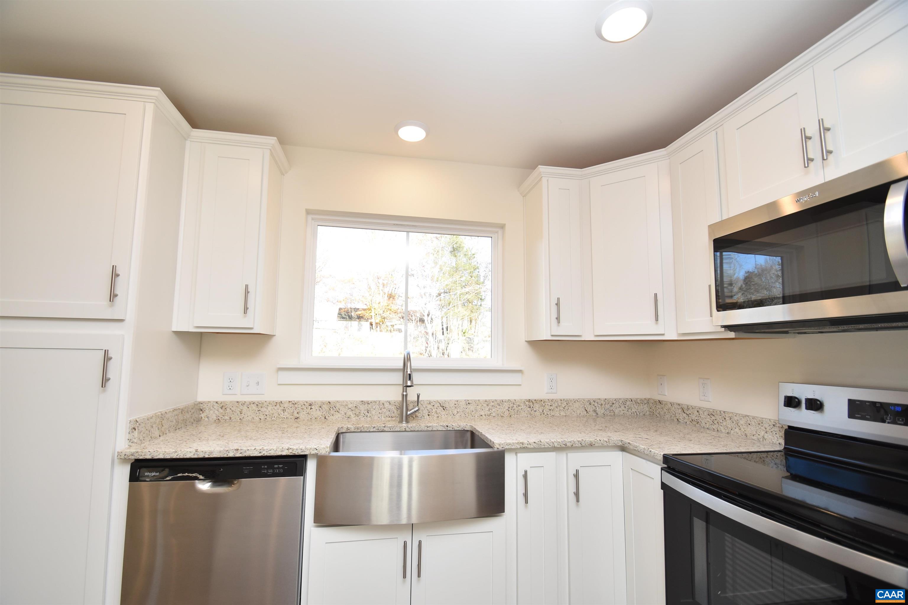 Lot4 Kidds Dairy Road, Unit KD4 Scottsville, VA 24590 - Photo 7 of 26 a kitchen with stainless steel appliances granite countertop a sink a stove and a microwave