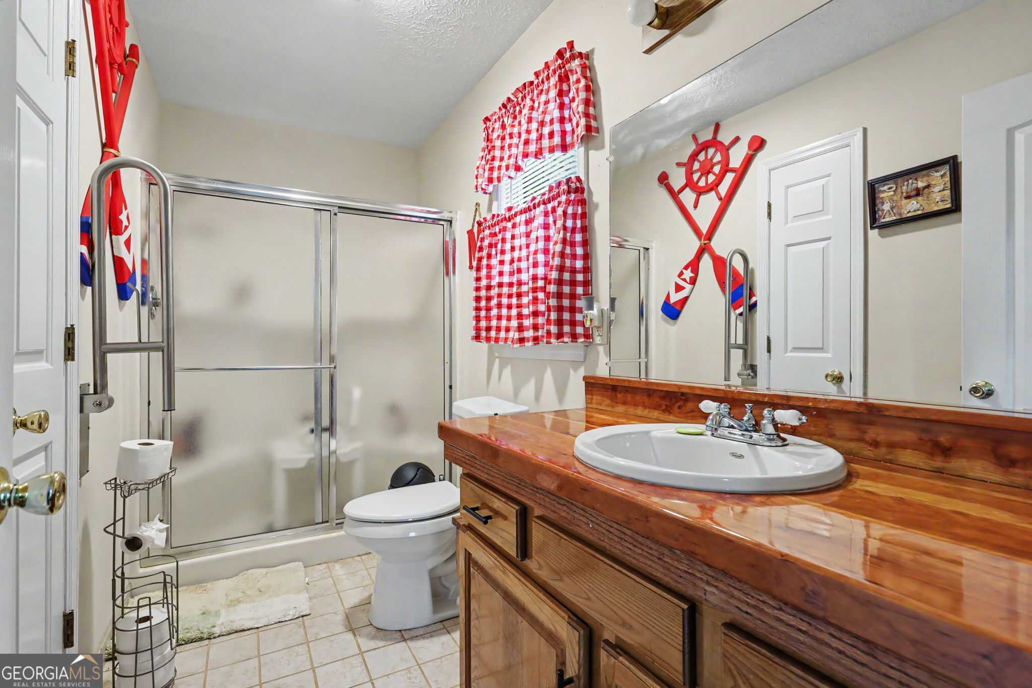 325 Walnut Mountain Road Rabun Gap, GA 30568 - Photo 15 of 38 a bathroom with a sink and a mirror