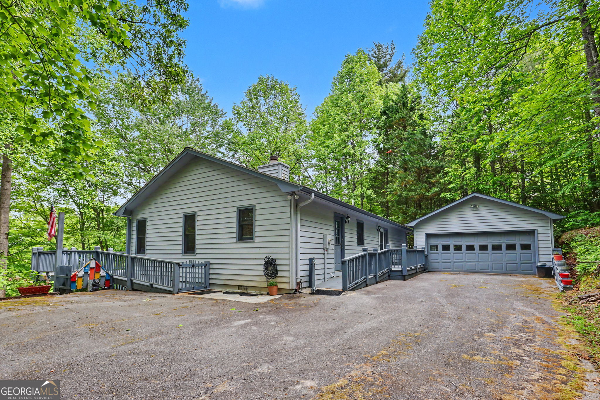 325 Walnut Mountain Road Rabun Gap, GA 30568 - Photo 32 of 38 a view of a house next to a yard