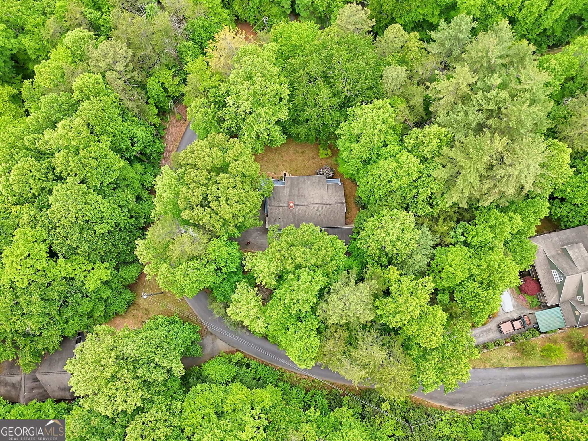 325 Walnut Mountain Road Rabun Gap, GA 30568 - Photo 4 of 38 an aerial view of a house with a yard