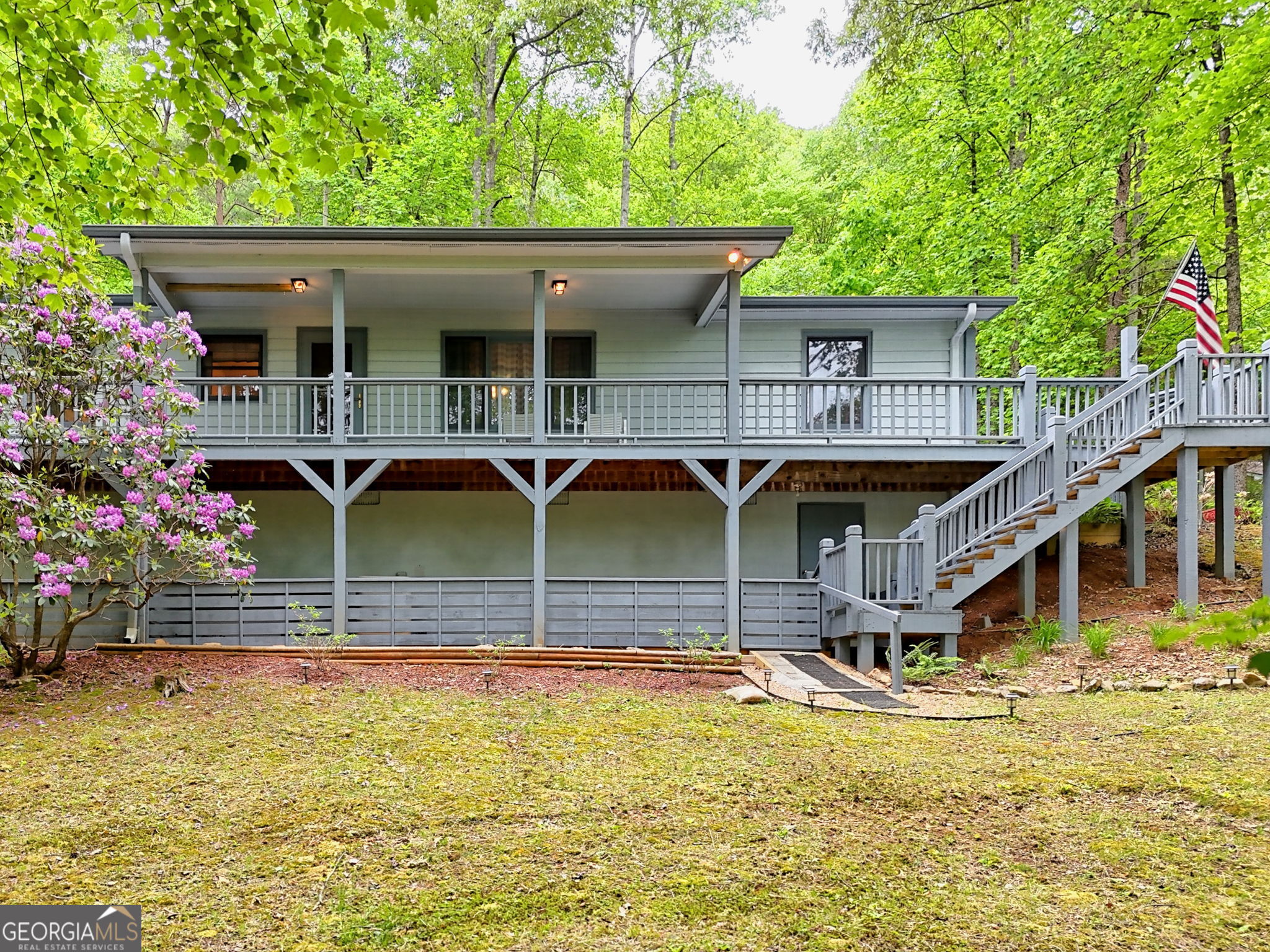 325 Walnut Mountain Road Rabun Gap, GA 30568 - Photo 6 of 38 a front view of a house with swimming pool