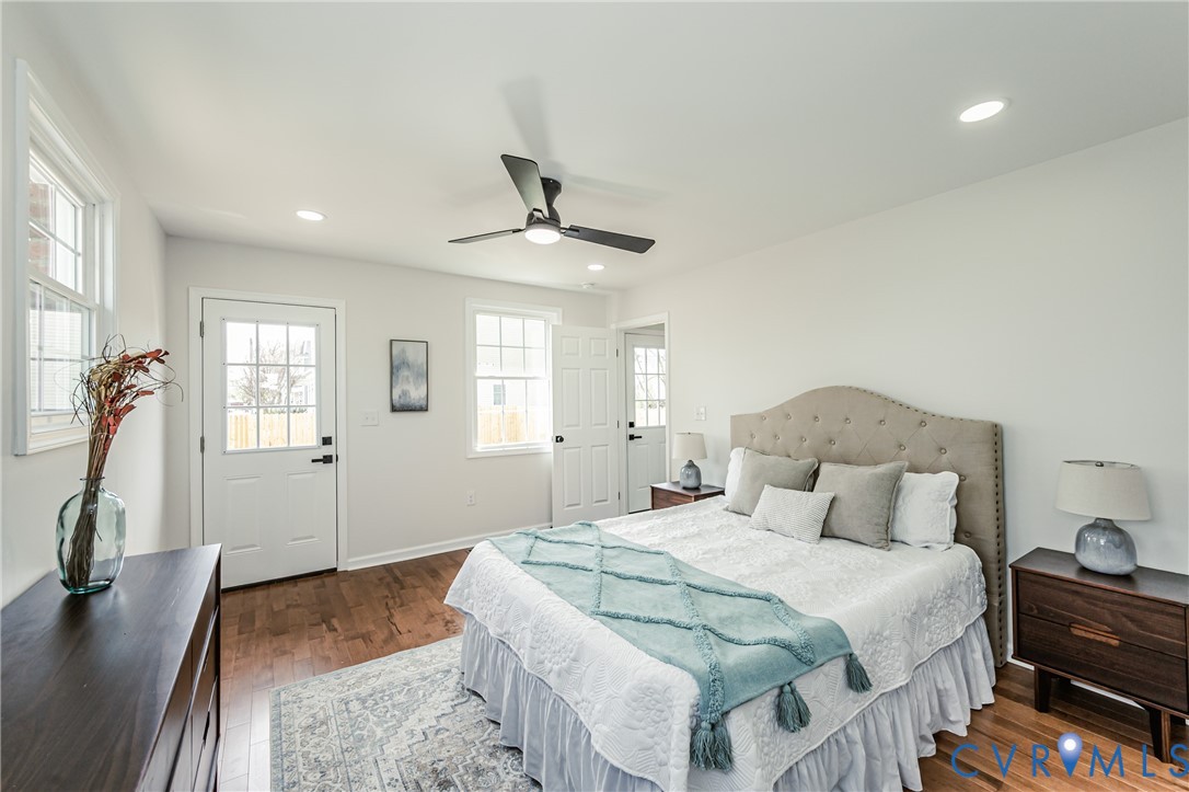 1400 Decatur Street Richmond, VA 23224 - Photo 30 of 49 a bedroom with a bed and a flat tv screen on the dresser