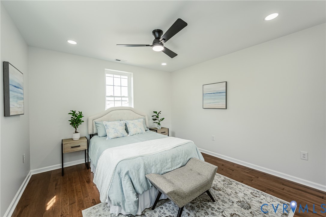 1400 Decatur Street Richmond, VA 23224 - Photo 41 of 49 a bedroom with a bed and wooden floor