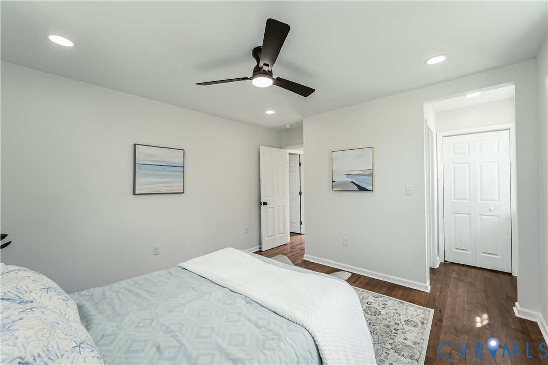 1400 Decatur Street Richmond, VA 23224 - Photo 44 of 49 a bedroom with a bed and a ceiling fan