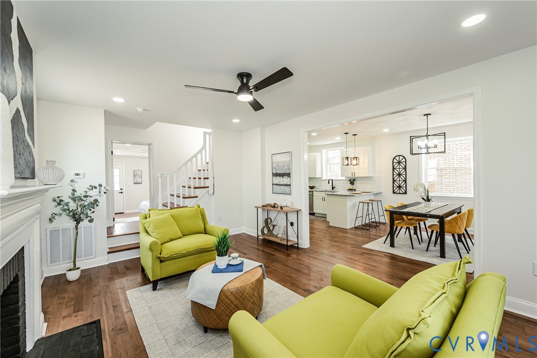 1400 Decatur Street Richmond, VA 23224 - Photo 8 of 49 a living room with furniture kitchen view and a chandelier