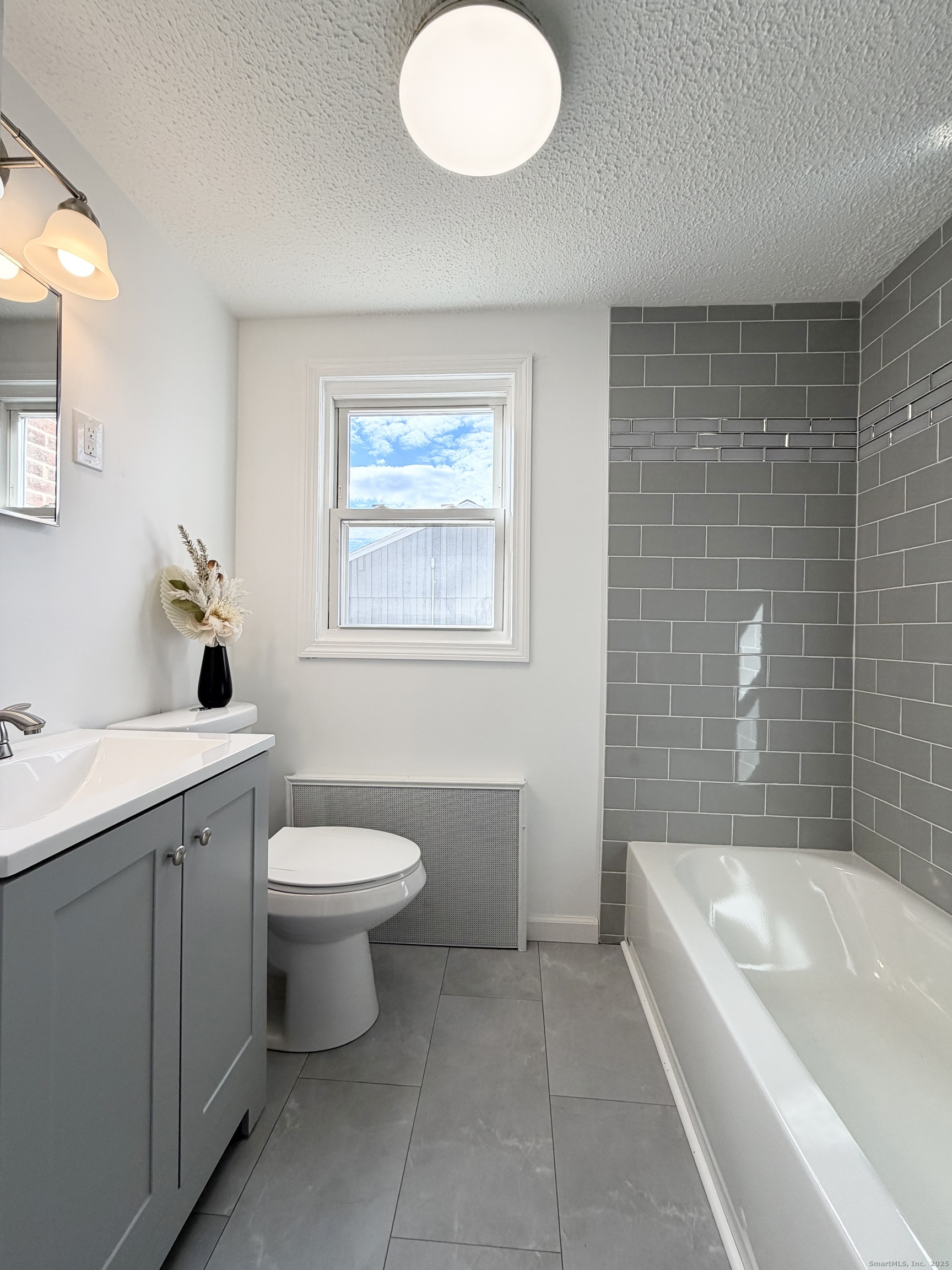 9 Eleanor Road Enfield, CT 06082 - Photo 20 of 32 a bathroom with a toilet sink and mirror