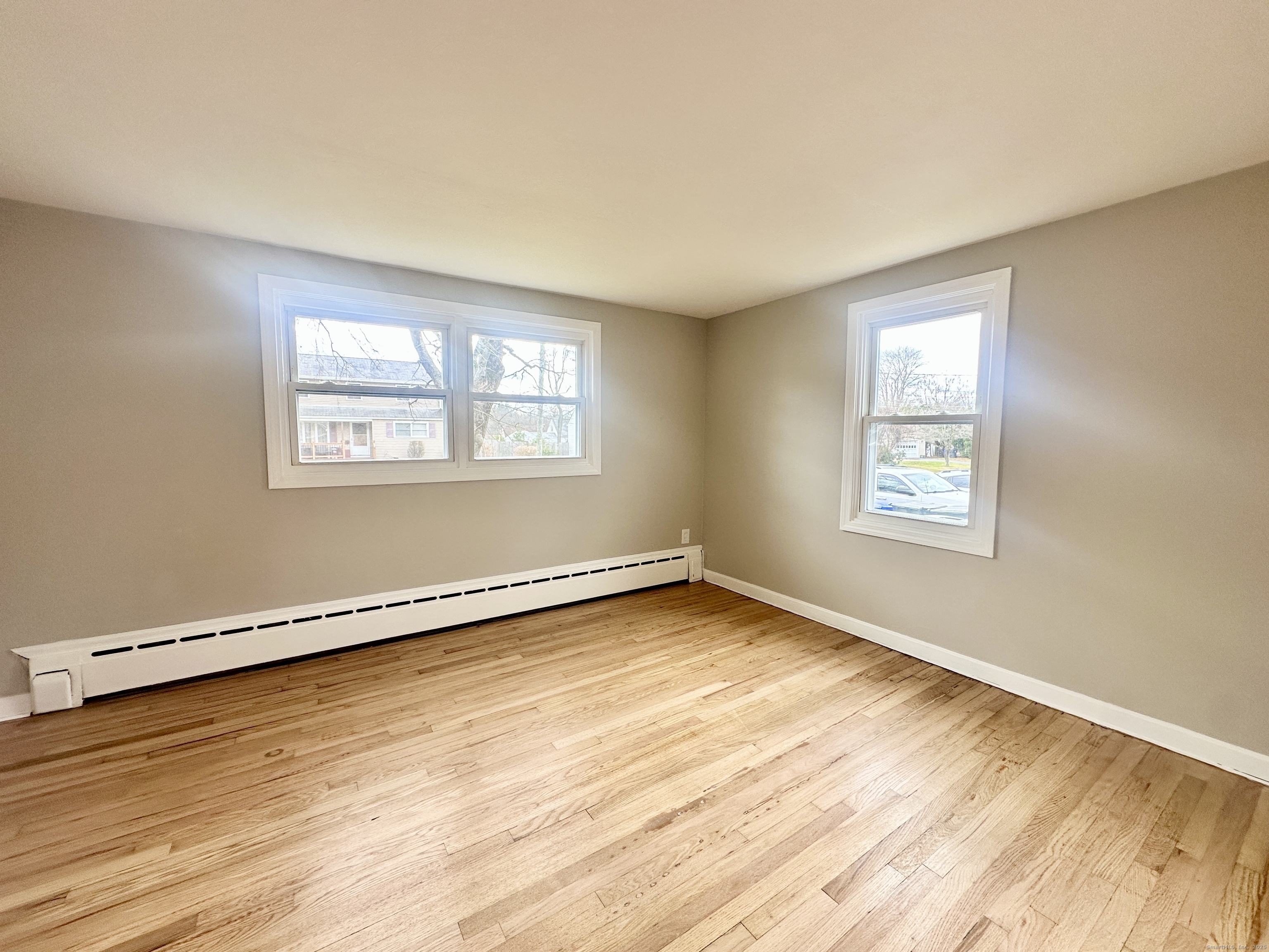 9 Eleanor Road Enfield, CT 06082 - Photo 25 of 32 a view of a room with wooden floor and window