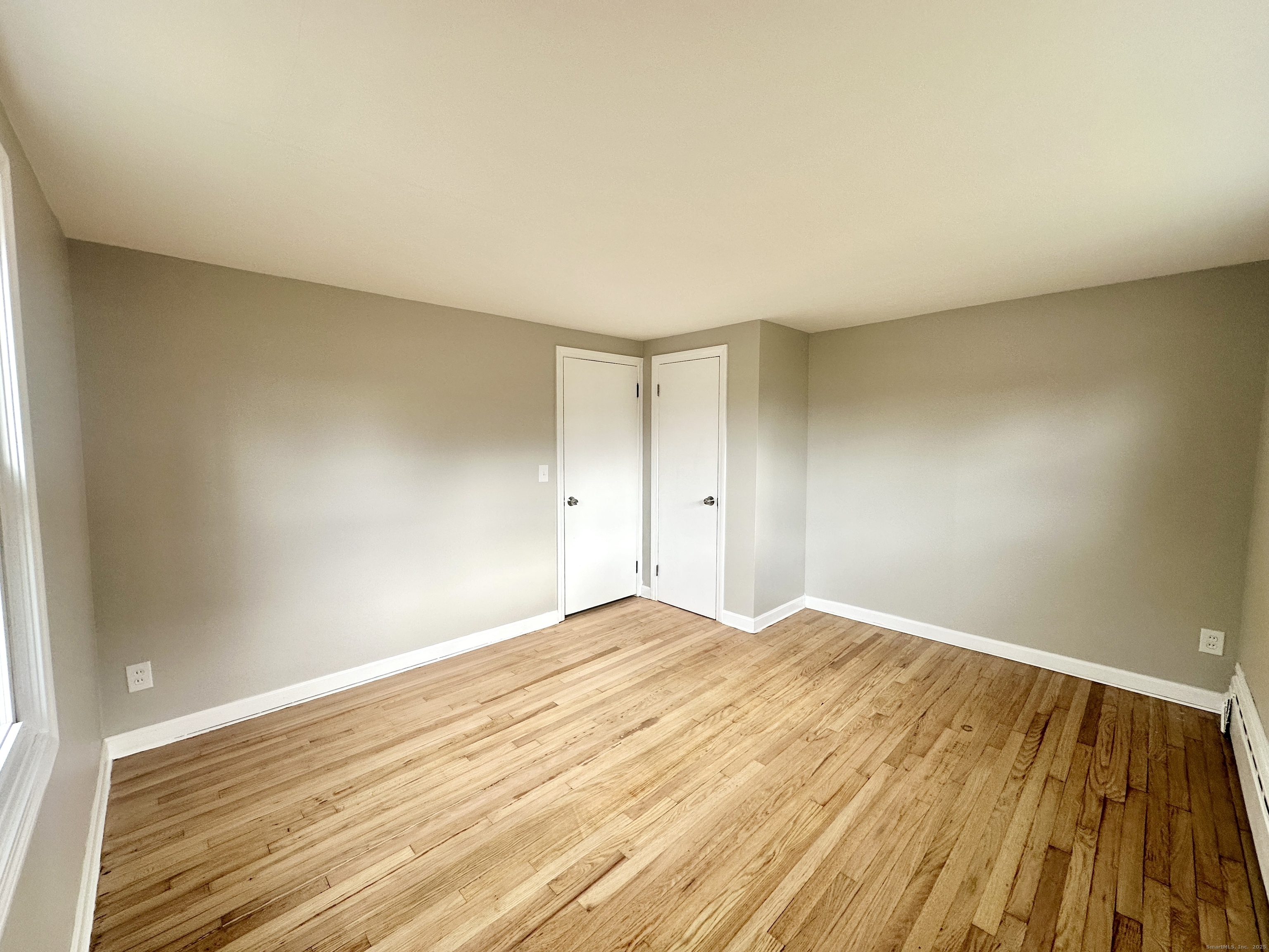 9 Eleanor Road Enfield, CT 06082 - Photo 26 of 32 a view of empty room with wooden floor