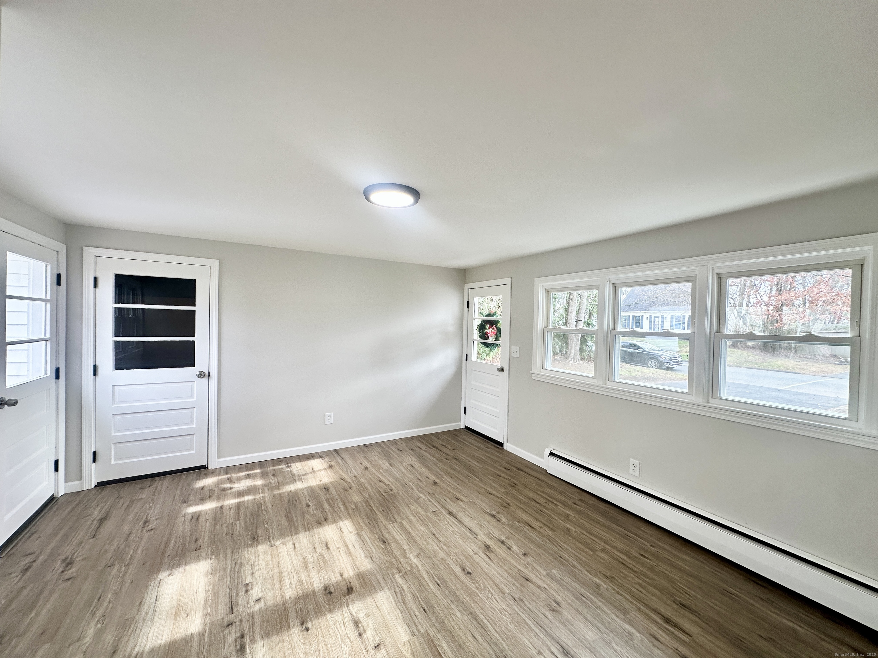 9 Eleanor Road Enfield, CT 06082 - Photo 8 of 32 an empty room with windows