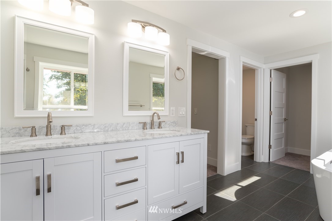 14425 Westwick Road Snohomish, WA 98290 - Photo 16 of 25 a bathroom with a granite countertop sink mirror and double