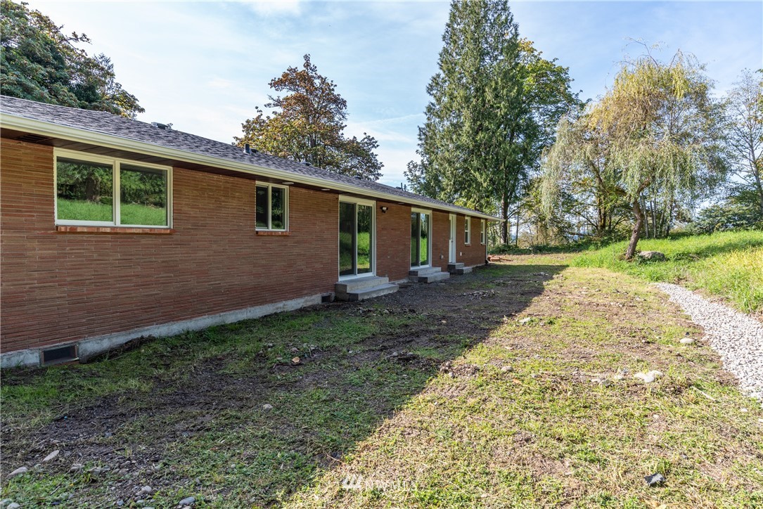 14425 Westwick Road Snohomish, WA 98290 - Photo 24 of 25 a view of a backyard with plants and large tree