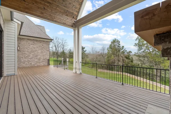 a view of a balcony with wooden floor