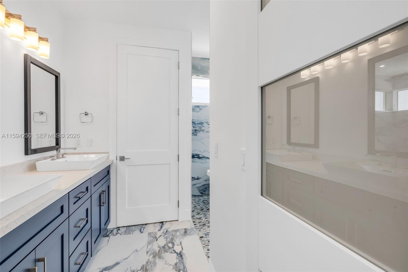 84 Coral Way Key Largo, FL 33037 - Photo 33 of 55 a bathroom with a tub sink and mirror