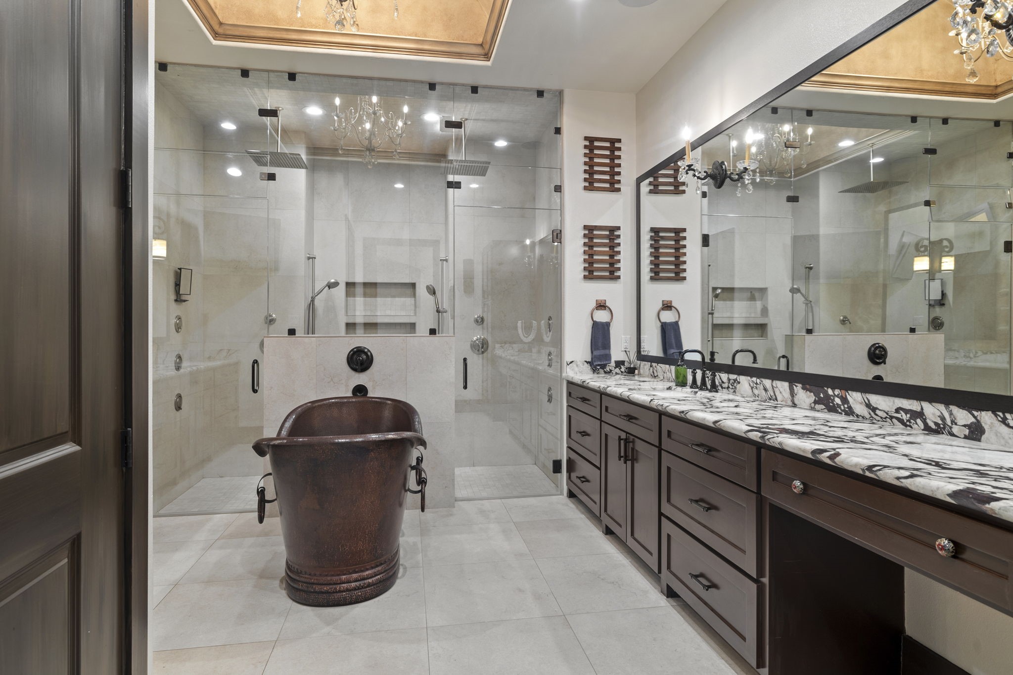 4322 Maple Rapids Court Spring, TX 77386 - Photo 29 of 48 Primary bath accenting 1 of 2 vanity areas, copper soaking tub and massive walk-in shower with multiple rain and body shower heads.