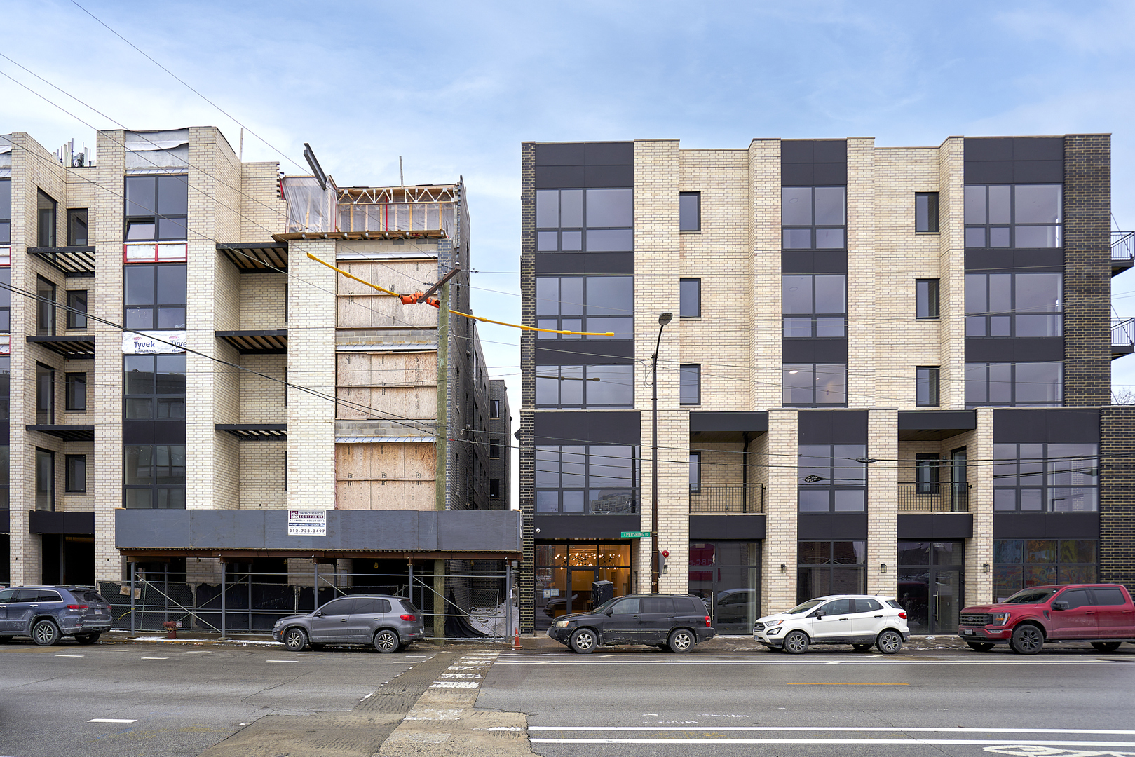 503 East Pershing Road, Unit 201 Chicago, IL 60653 - Photo 1 of 29 a city street lined with tall buildings