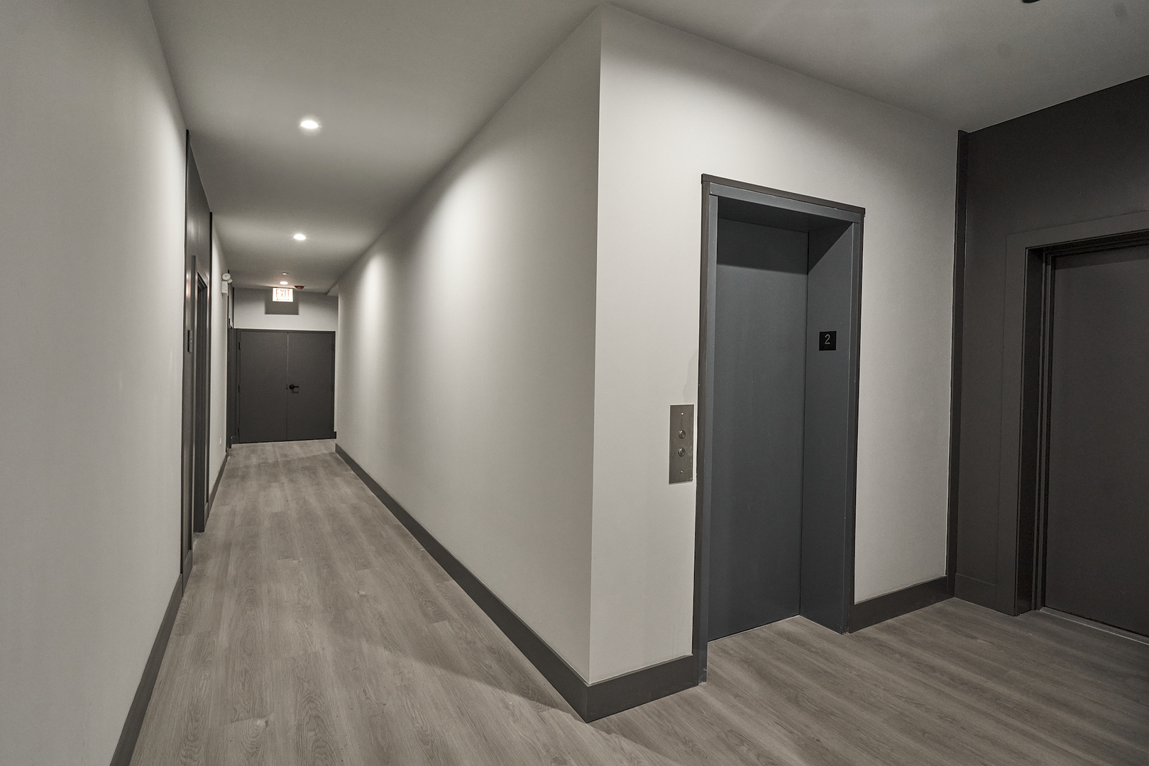 503 East Pershing Road, Unit 201 Chicago, IL 60653 - Photo 16 of 29 a view of a hallway with wooden floor