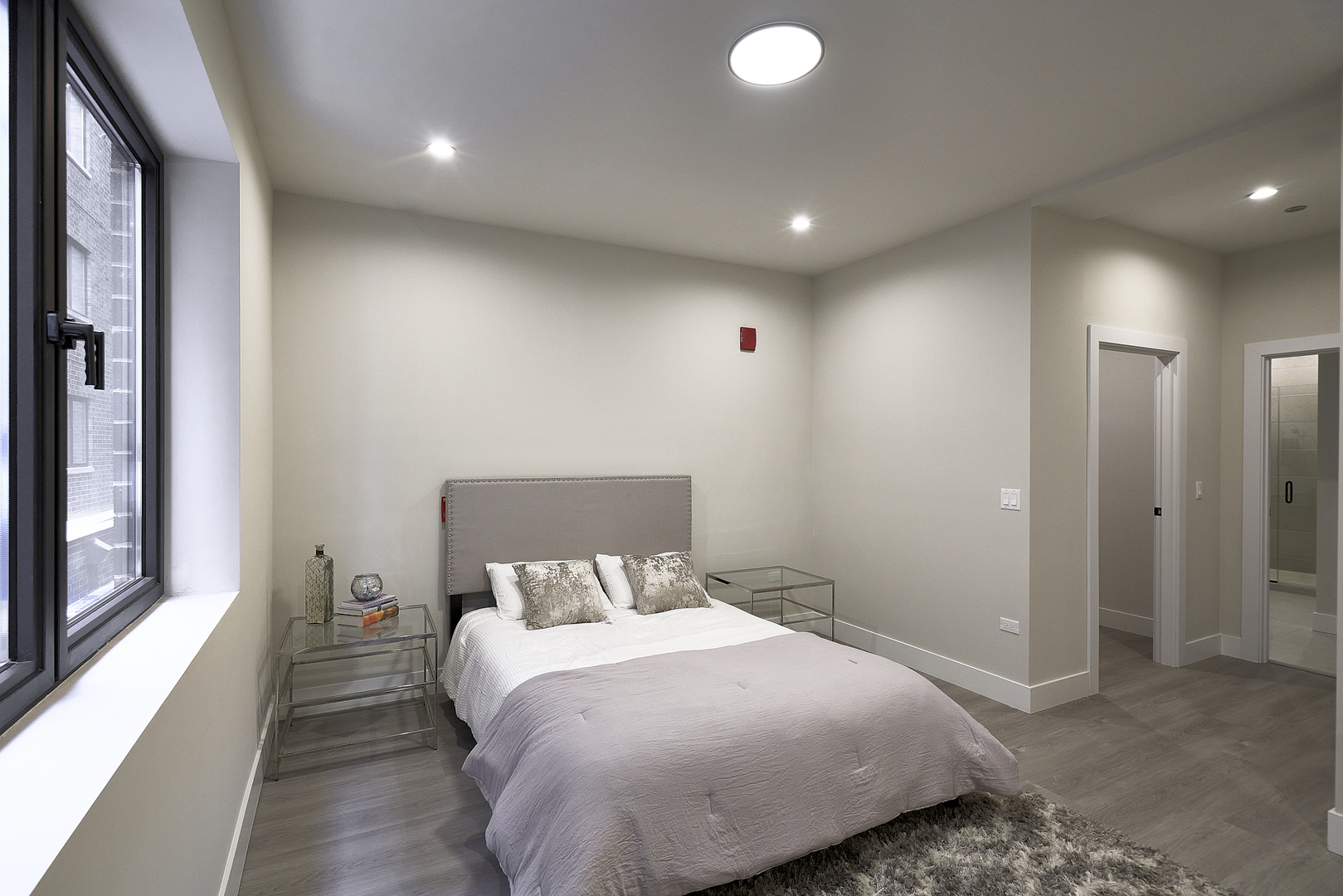 503 East Pershing Road, Unit 201 Chicago, IL 60653 - Photo 25 of 29 a bed room with a bed and a window