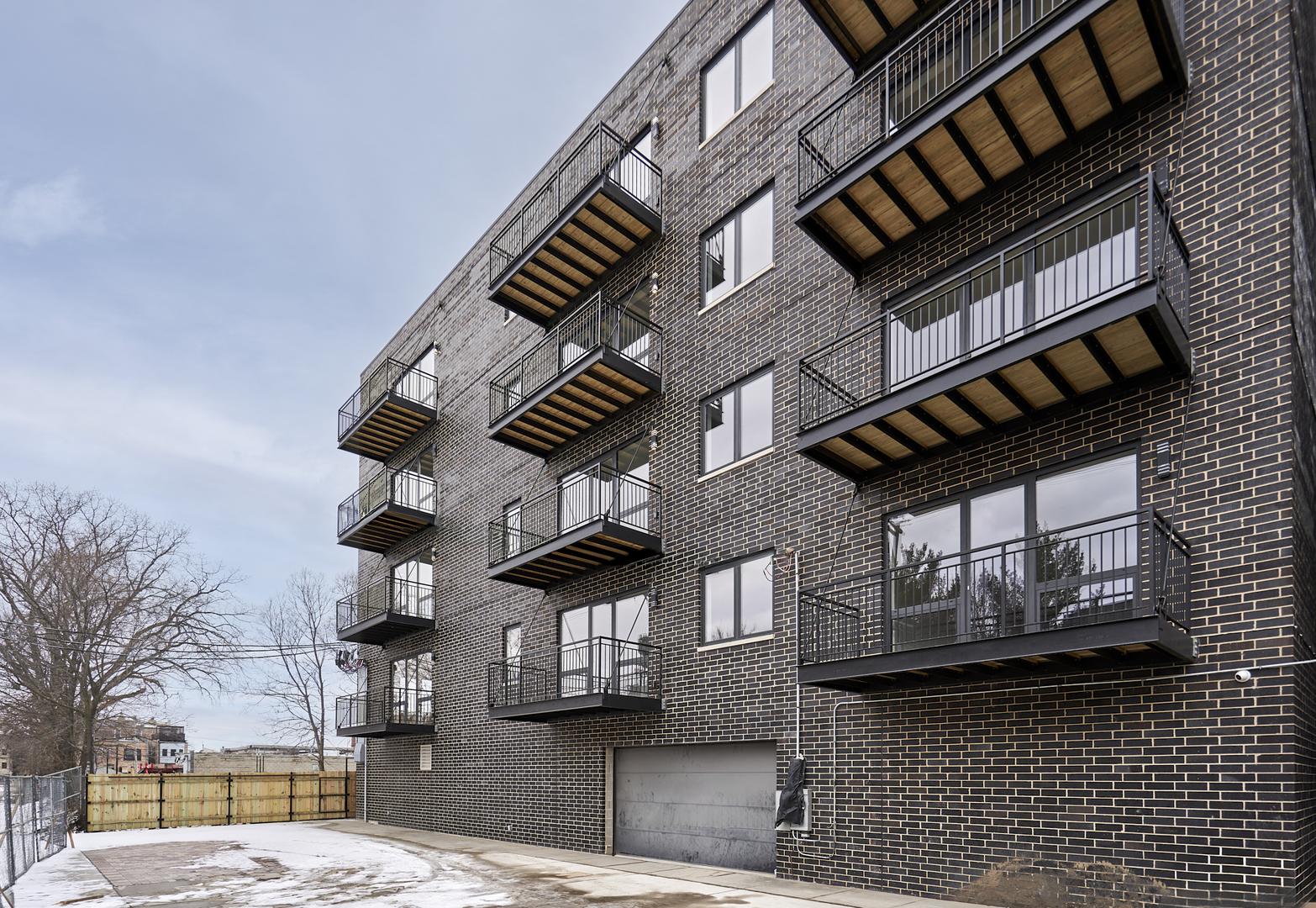 503 East Pershing Road, Unit 201 Chicago, IL 60653 - Photo 5 of 29 a front view of a building with streets and trees
