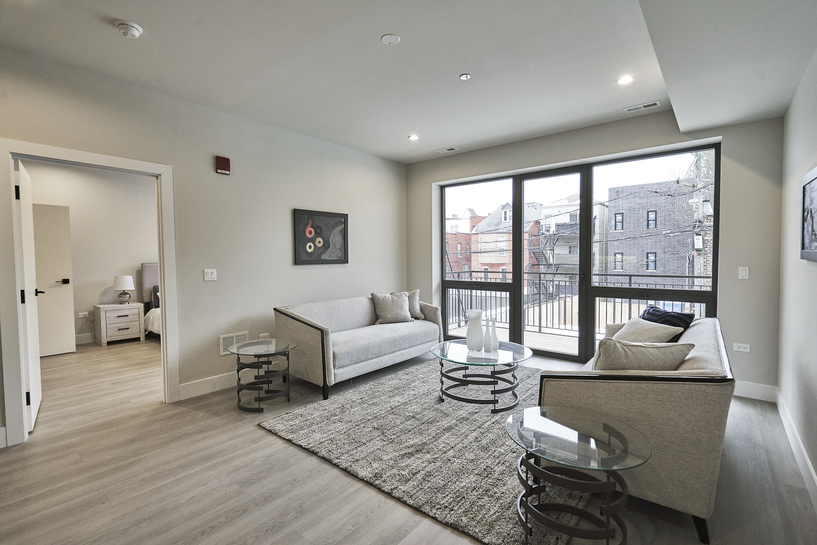 503 East Pershing Road, Unit 201 Chicago, IL 60653 - Photo 7 of 29 a living room with furniture and a large window