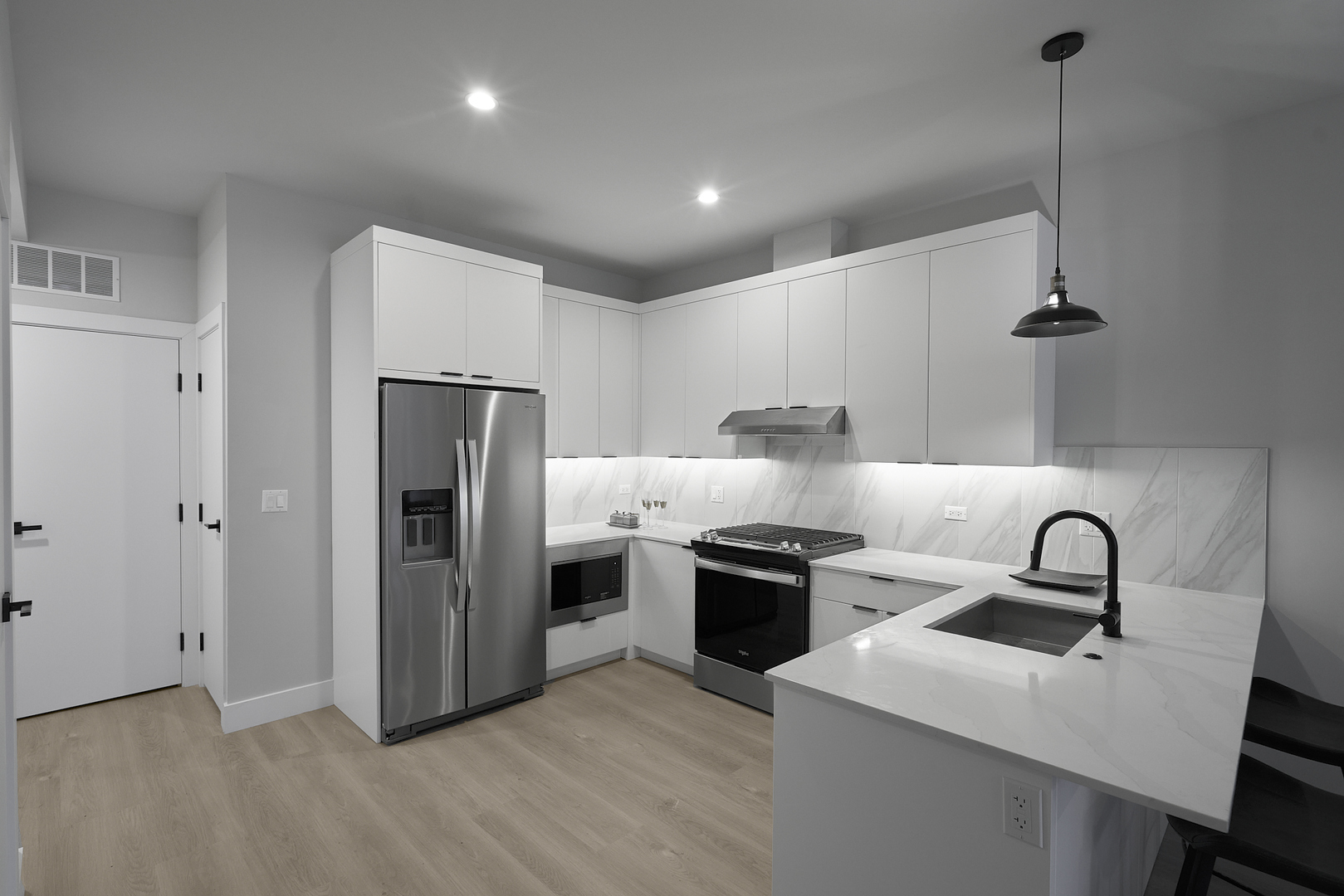 503 East Pershing Road, Unit 201 Chicago, IL 60653 - Photo 9 of 29 a kitchen with stainless steel appliances a refrigerator sink and stove