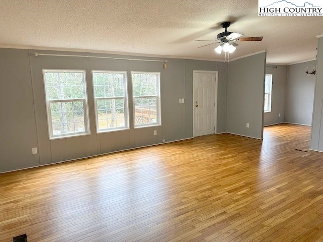 68 Rhoneys View Road Newland, NC 28657 - Photo 18 of 37 a view of an empty room with glass door and wooden floor