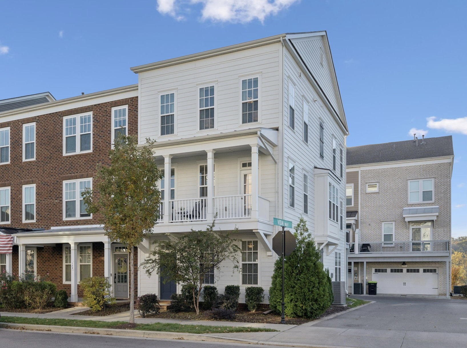 a front view of a building with a yard