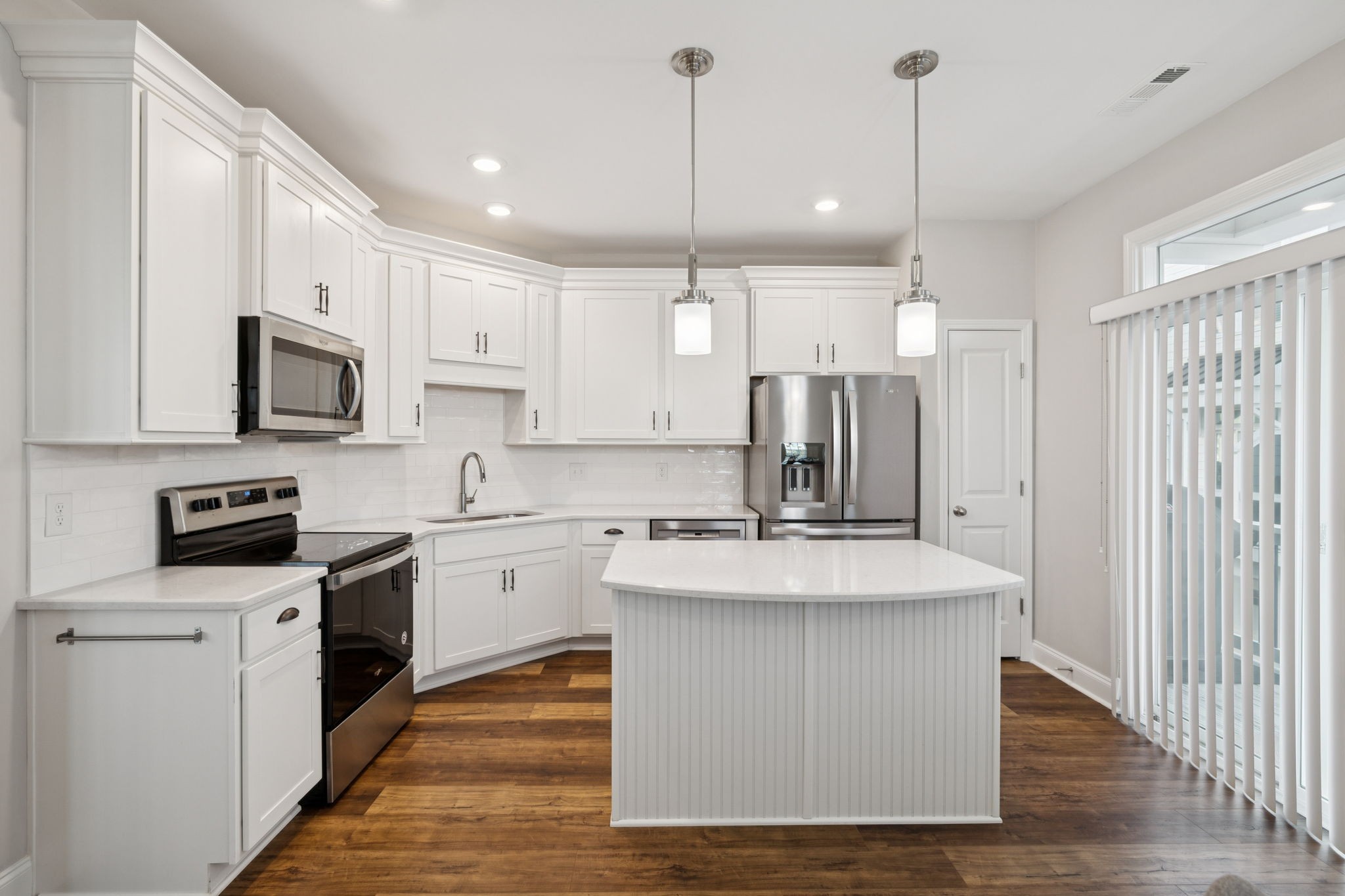 185 Burkitt Commons Avenue Nolensville, TN 37135 - Photo 20 of 46 a large kitchen with stainless steel appliances granite countertop a sink a stove and a refrigerator