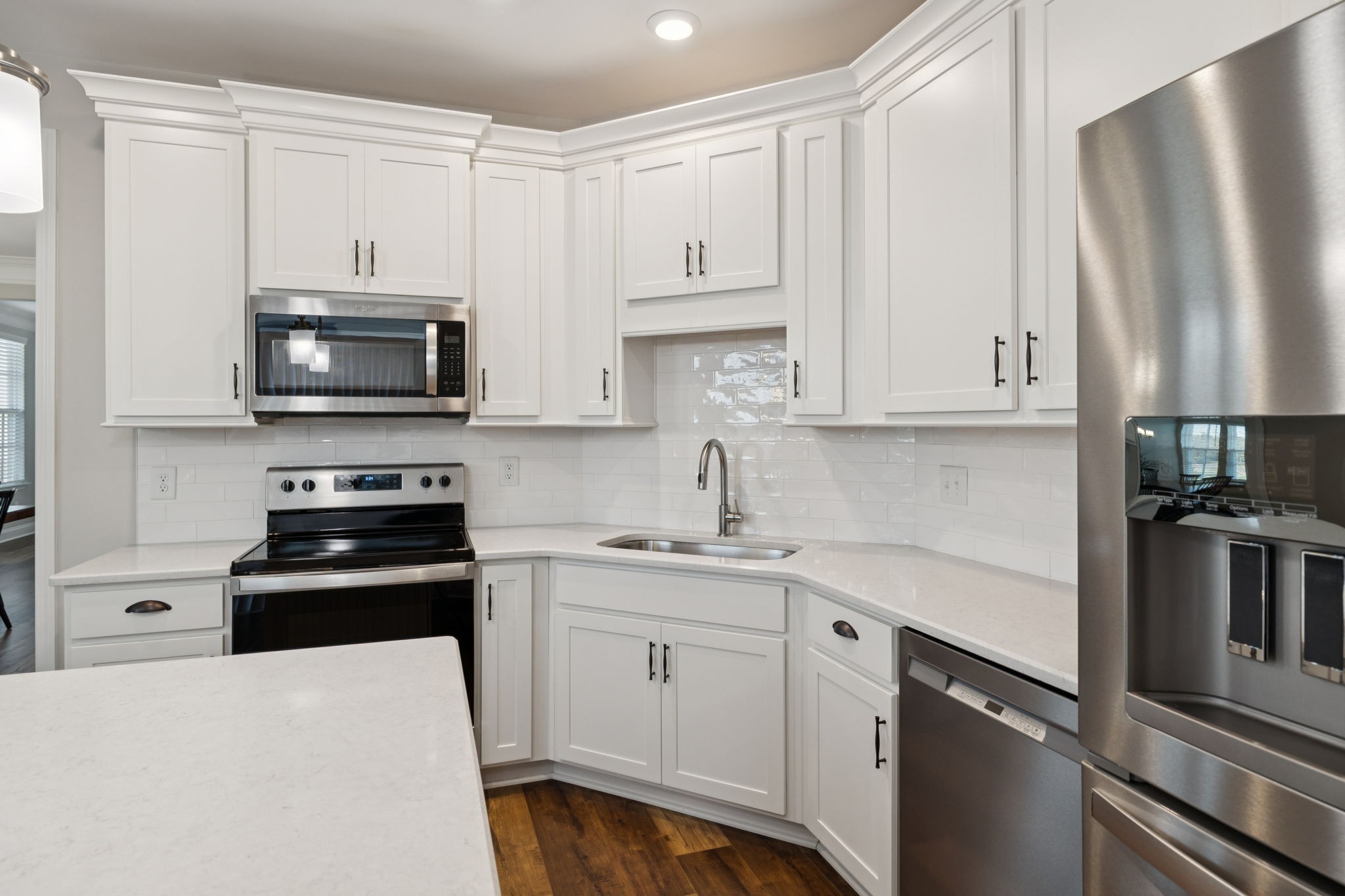 185 Burkitt Commons Avenue Nolensville, TN 37135 - Photo 23 of 46 a kitchen with granite countertop white cabinets and stainless steel appliances