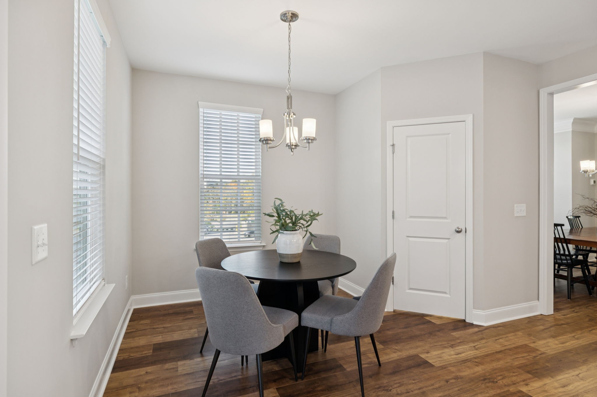 185 Burkitt Commons Avenue Nolensville, TN 37135 - Photo 24 of 46 a dining room with furniture wooden floor a rug and a chandelier