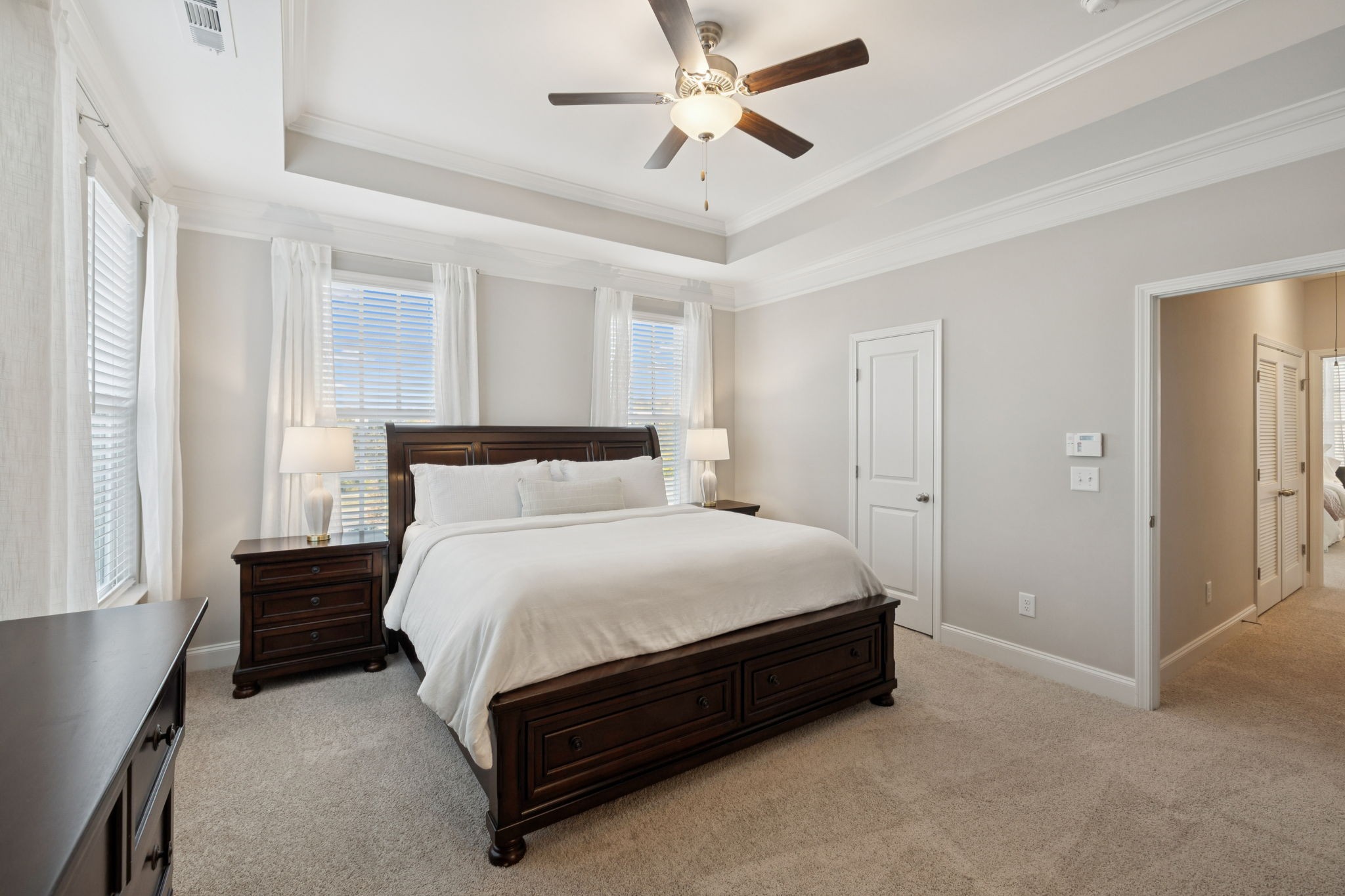 185 Burkitt Commons Avenue Nolensville, TN 37135 - Photo 28 of 46 a spacious bedroom with a bed and a chandelier