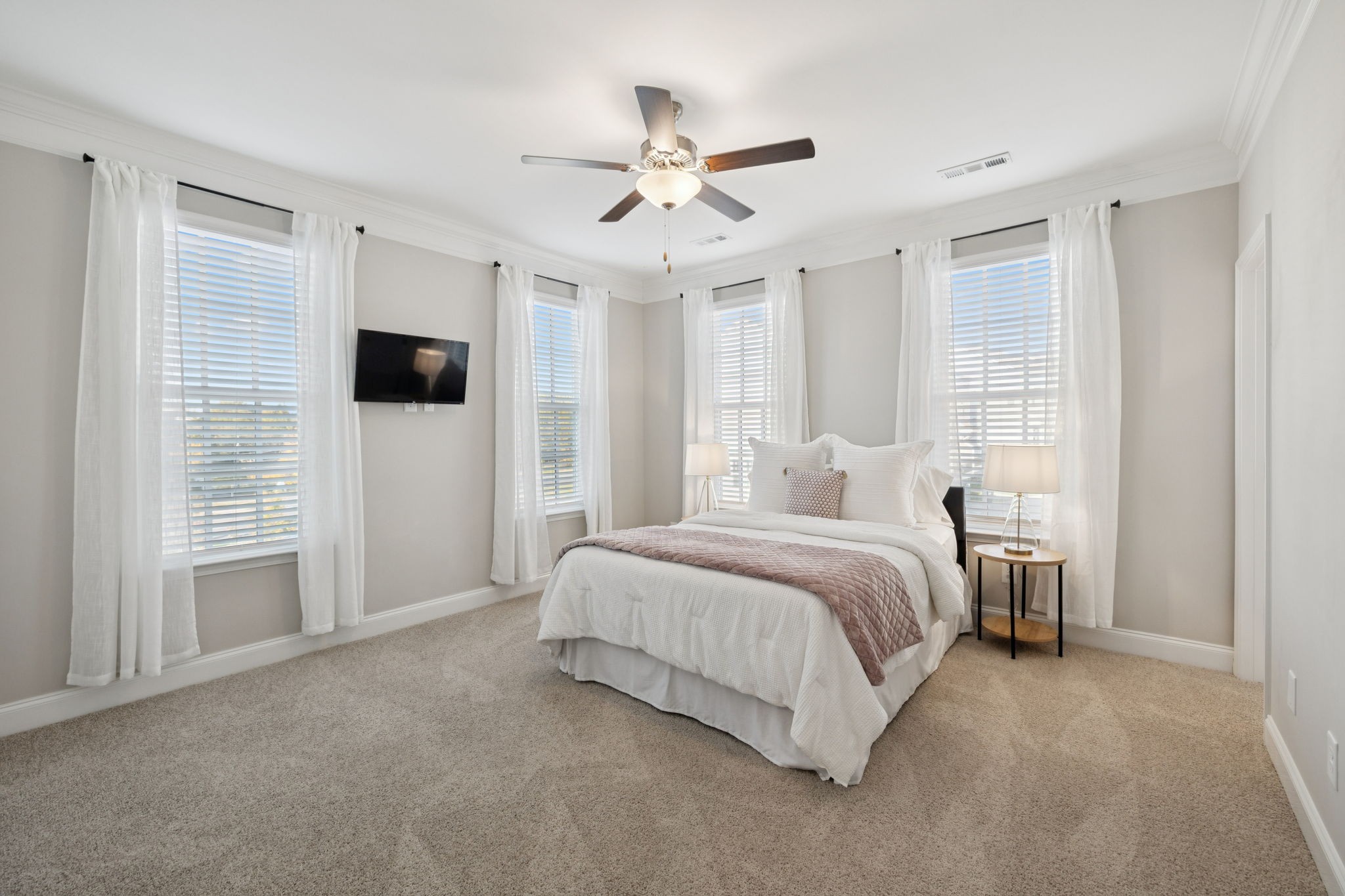 185 Burkitt Commons Avenue Nolensville, TN 37135 - Photo 33 of 46 a spacious bedroom with a bed and a ceiling fan