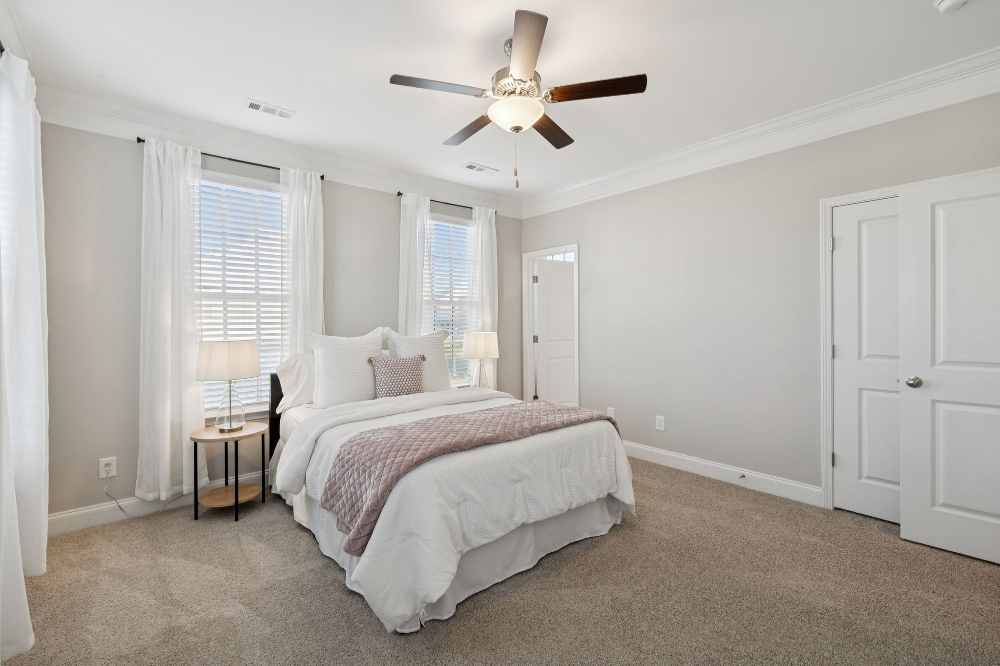 185 Burkitt Commons Avenue Nolensville, TN 37135 - Photo 34 of 46 a spacious bedroom with a bed and a ceiling fan