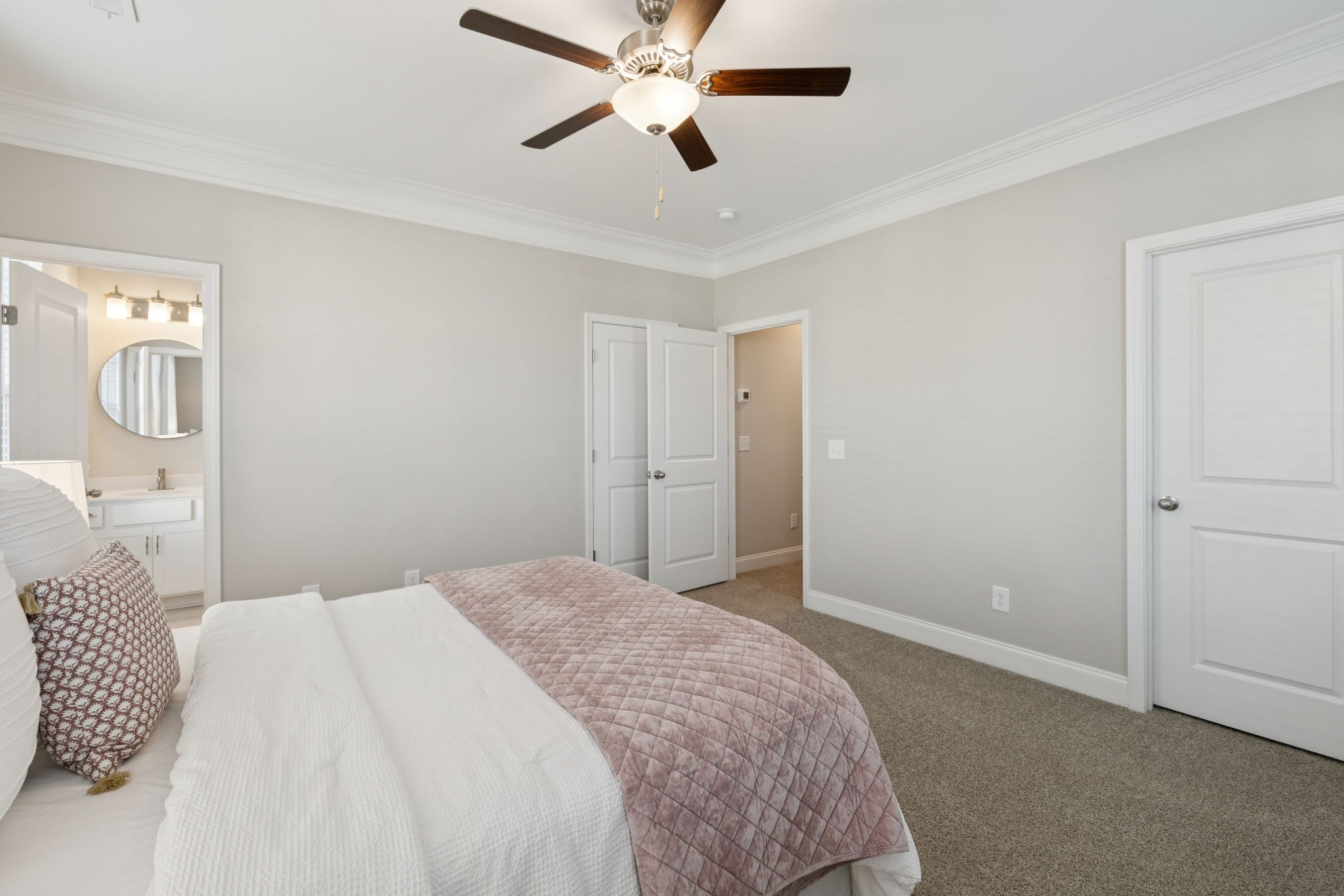 185 Burkitt Commons Avenue Nolensville, TN 37135 - Photo 35 of 46 a bedroom with a bed and a chandelier
