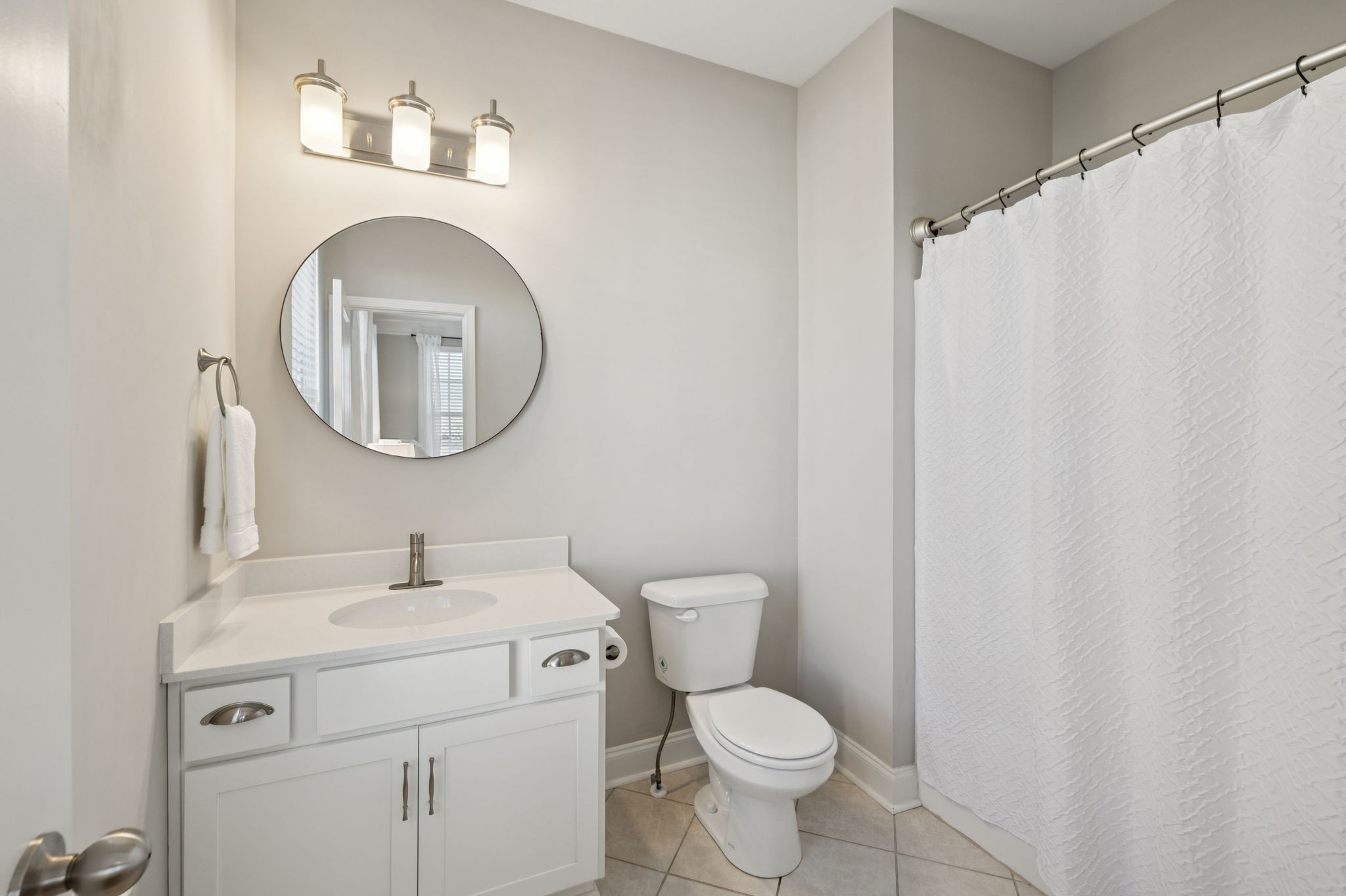 185 Burkitt Commons Avenue Nolensville, TN 37135 - Photo 36 of 46 a bathroom with a toilet sink vanity and mirror