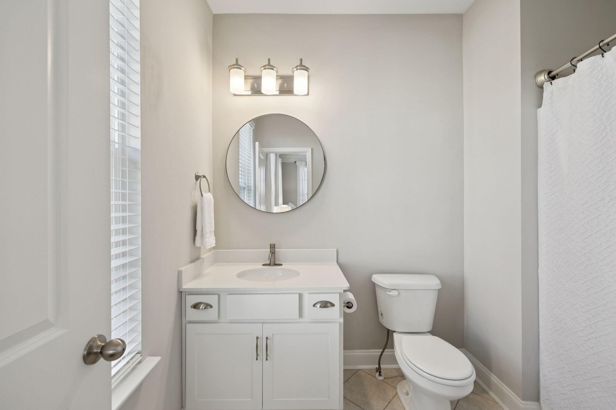 185 Burkitt Commons Avenue Nolensville, TN 37135 - Photo 37 of 46 a bathroom with a toilet sink vanity and mirror