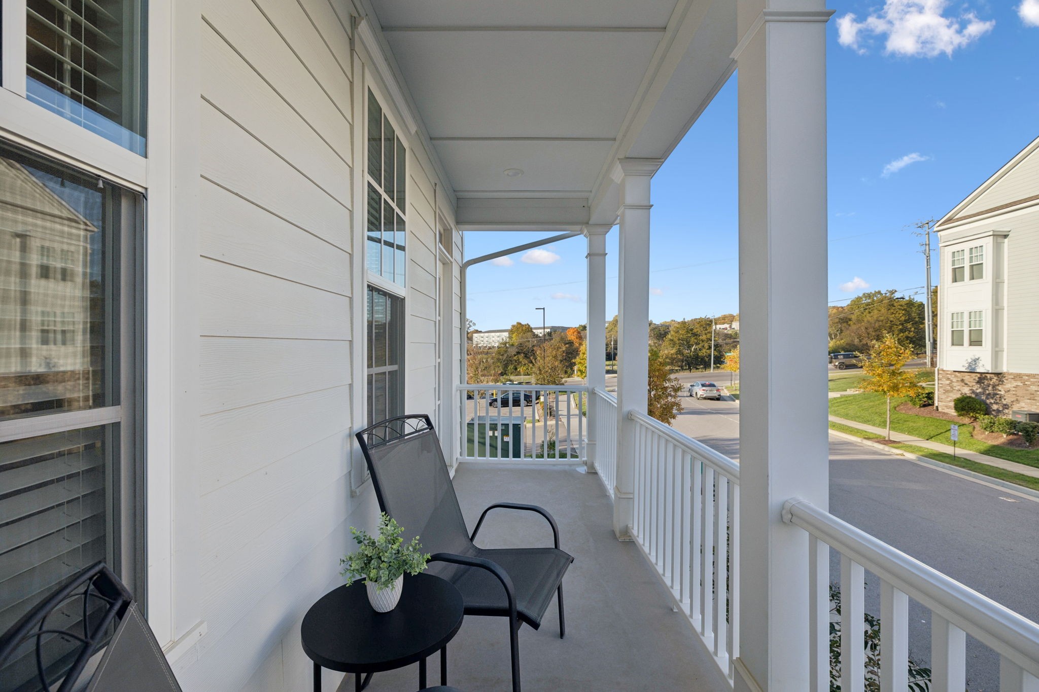 185 Burkitt Commons Avenue Nolensville, TN 37135 - Photo 40 of 46 a view of a balcony with chairs and a potted plant