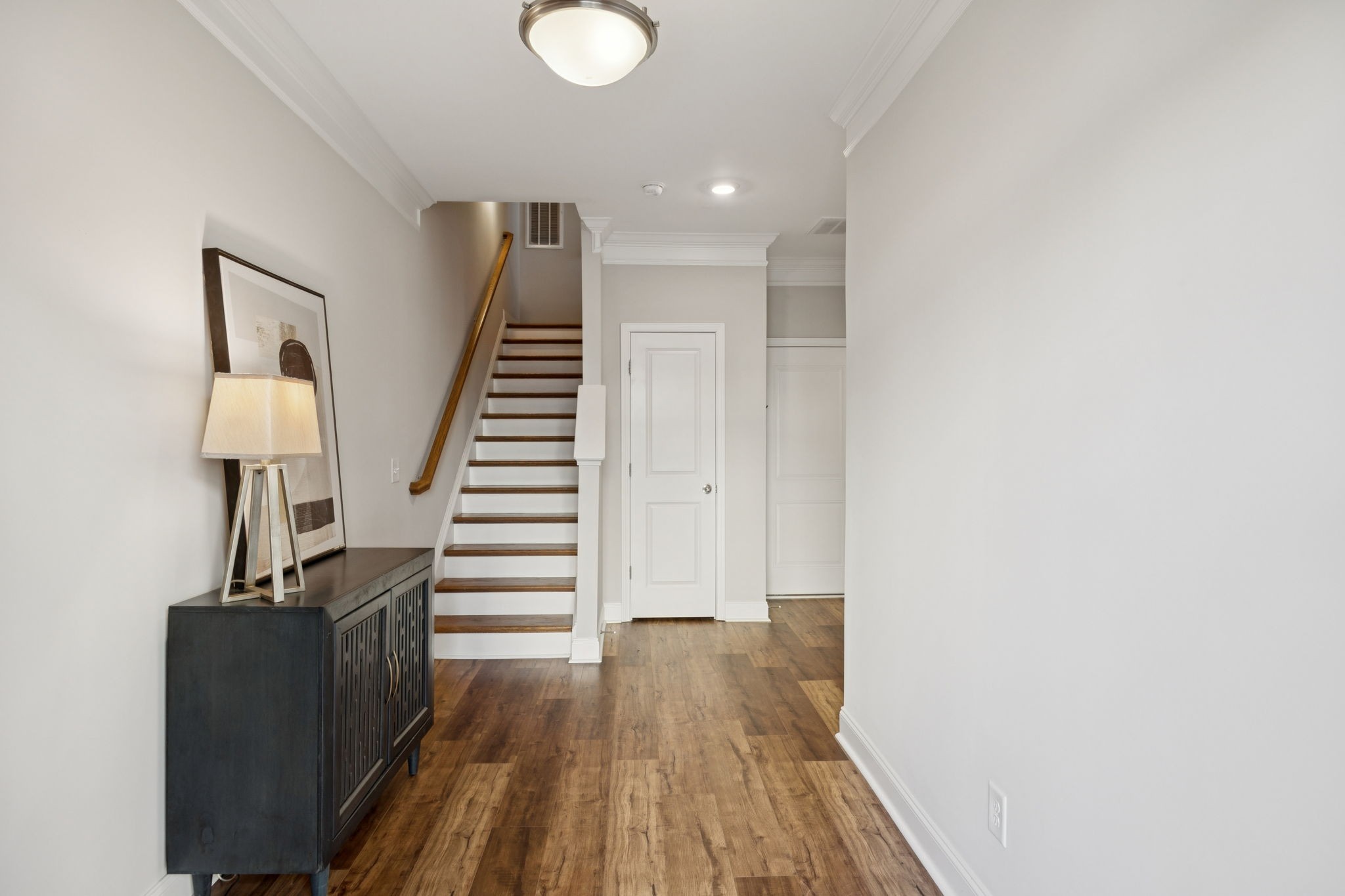 185 Burkitt Commons Avenue Nolensville, TN 37135 - Photo 4 of 46 a view of a hallway with wooden floor and staircase